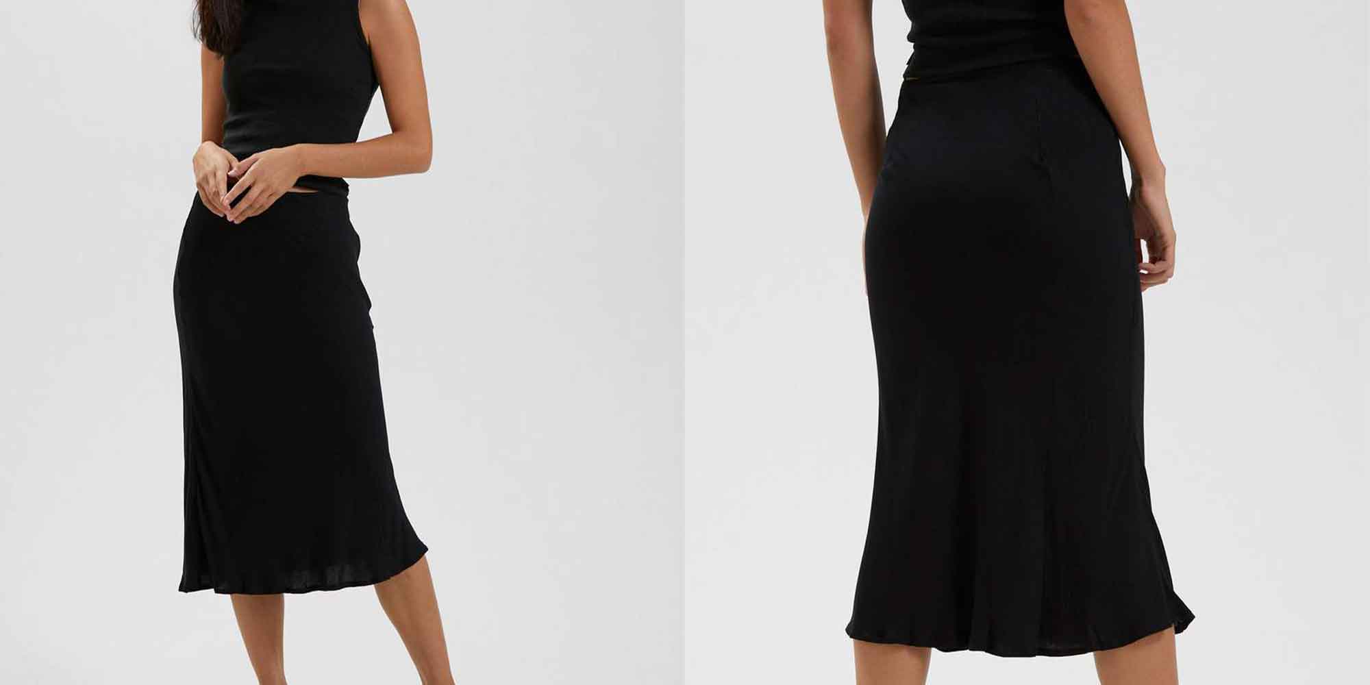 woman wearing black ethical mid length skirt by Afends