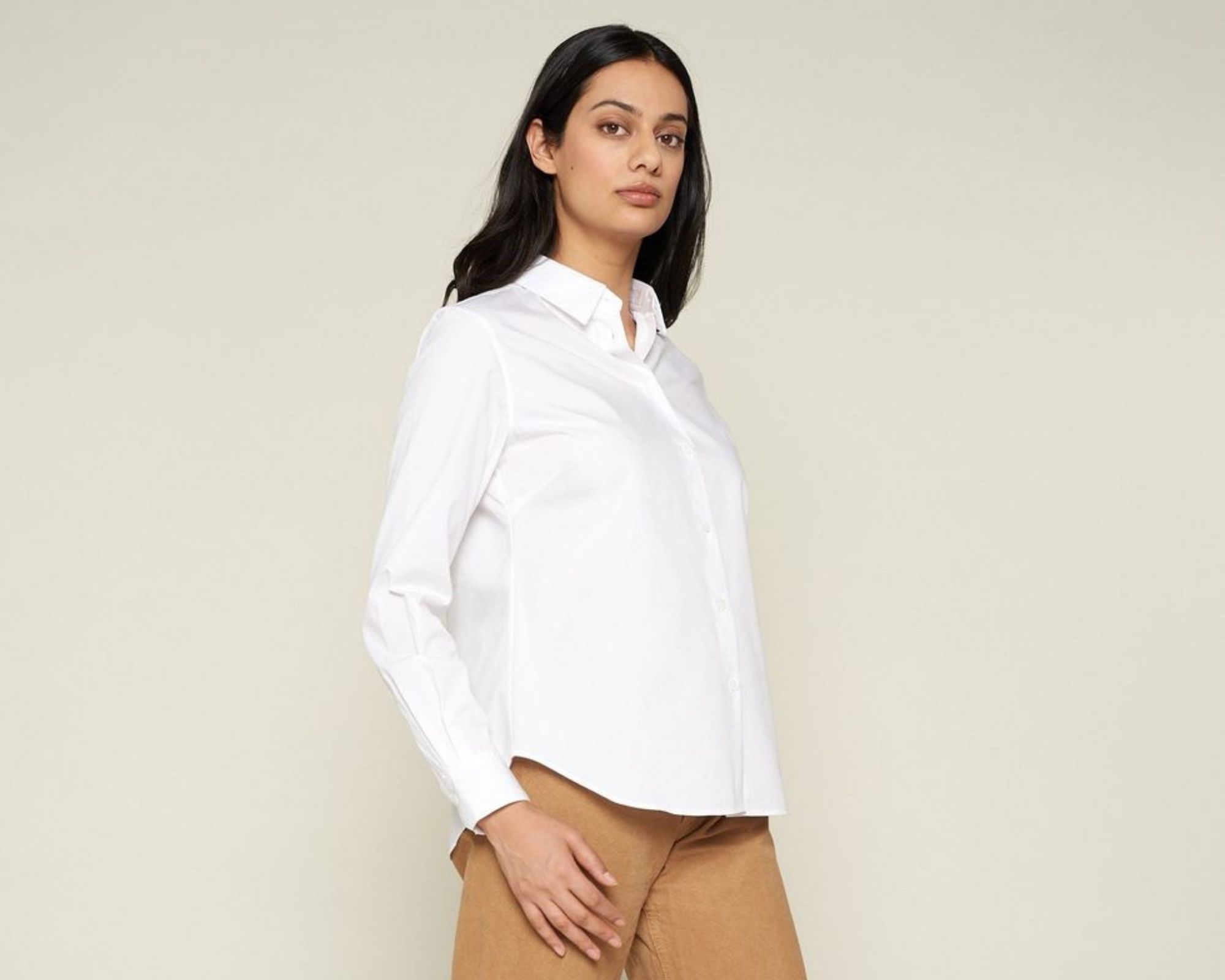 woman wearing sustainably made white dress shirt by GRAMMAR NYC