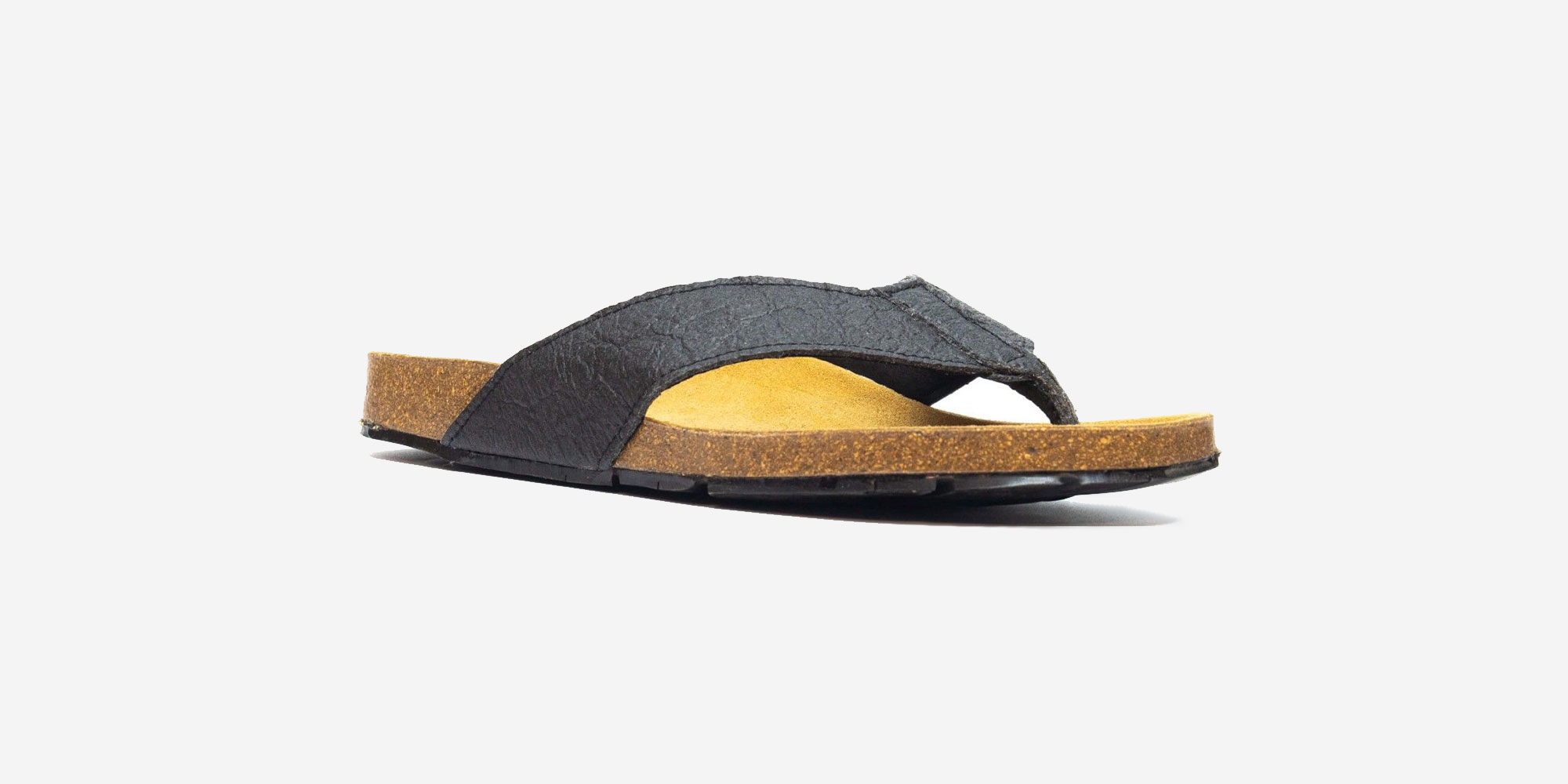 Side view of NAE Pinatex flipflops in black with a cork base.