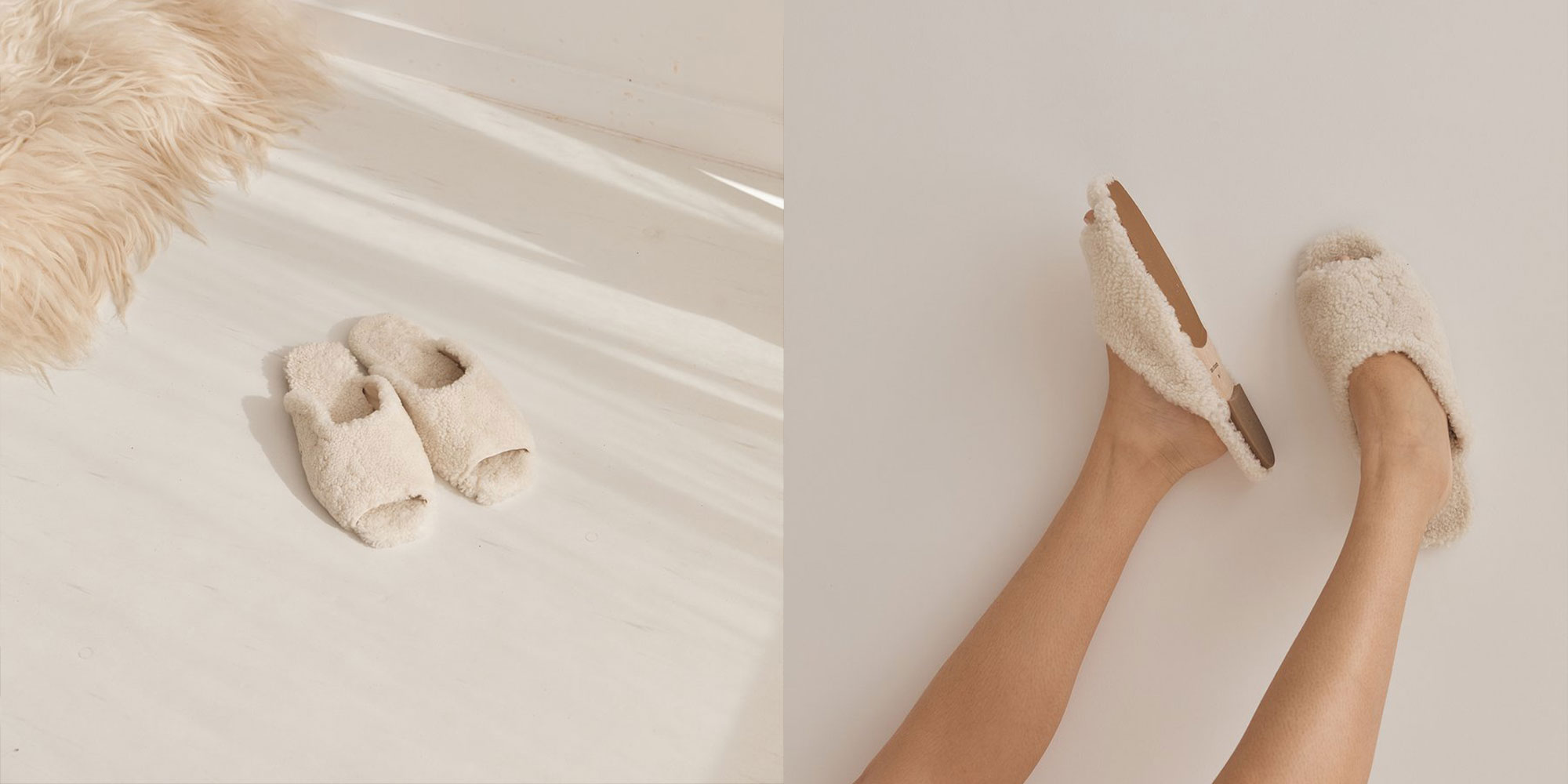 A person kicking their legs up a white wall wearing fluffy cream shearling wool slippers by Deiji.