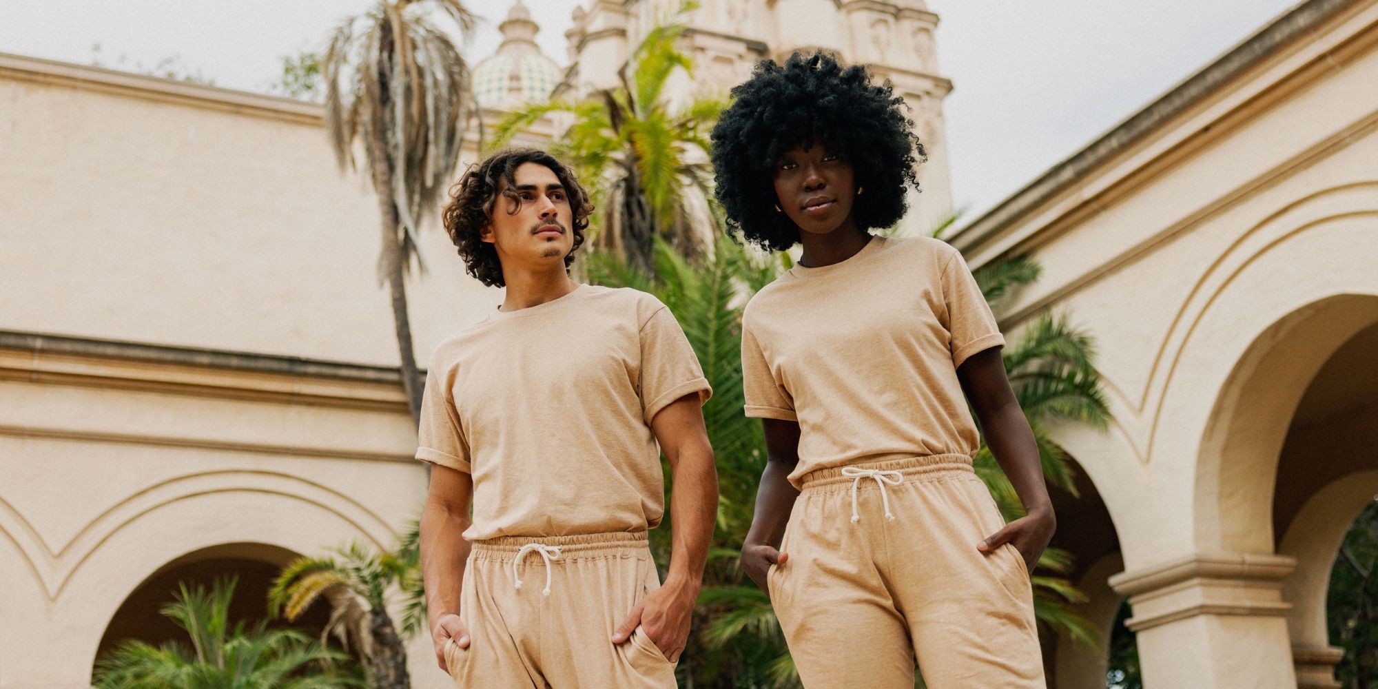 two people wearing natural brown undyed cotton tops and joggers by Harvest & Mill
