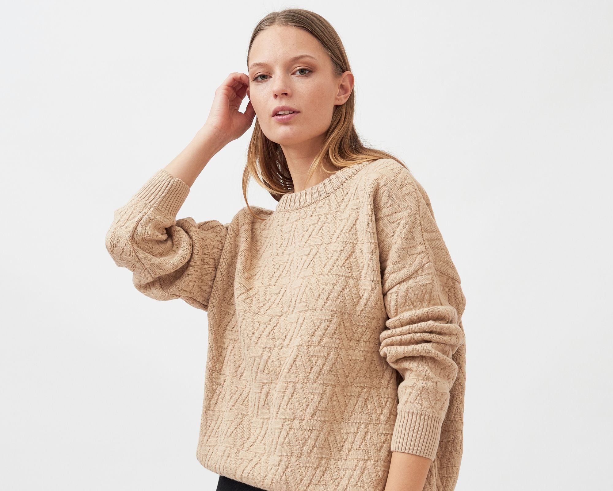 woman wearing sand coloured sustainable pullover by Mila.Vert