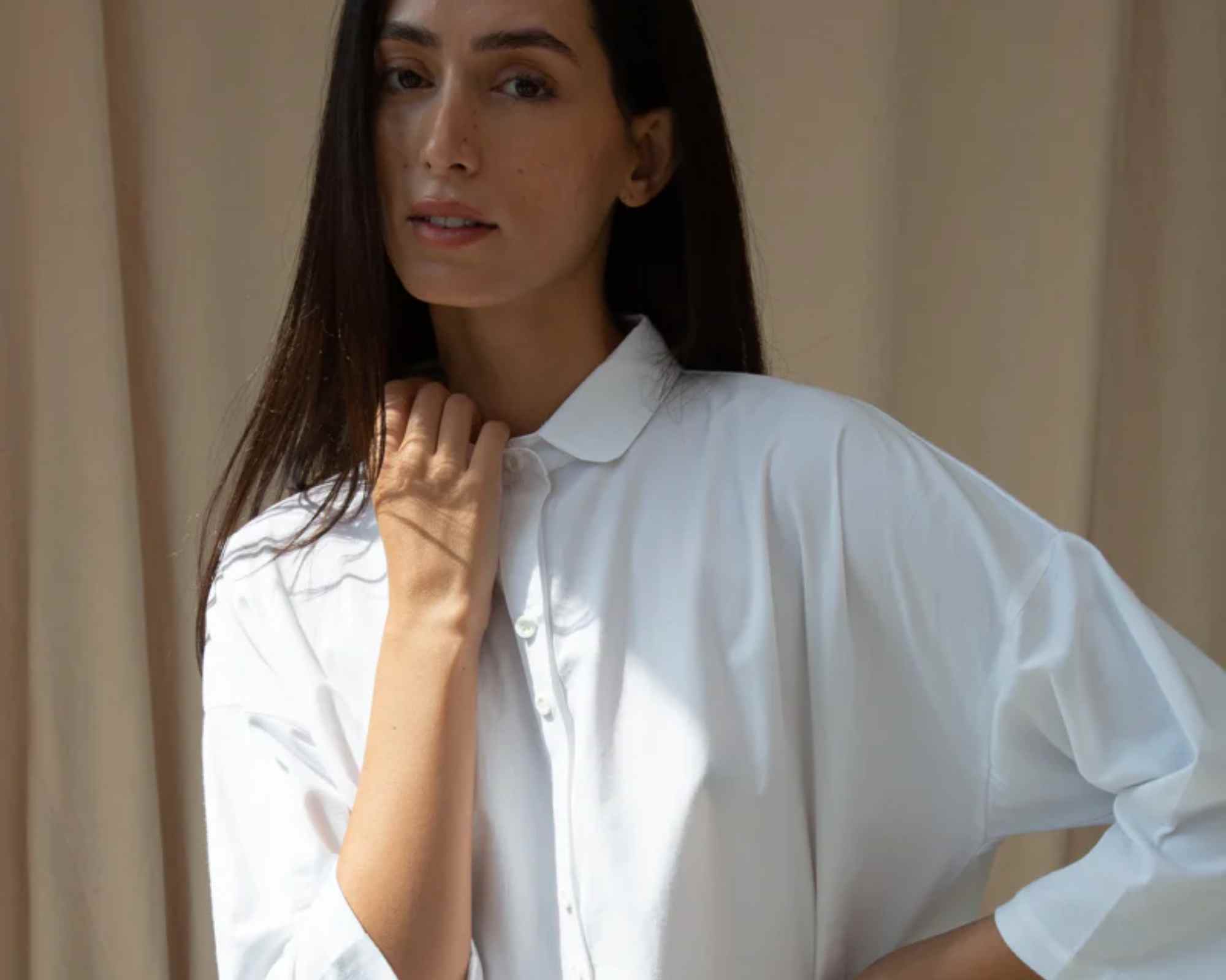 person wearing more ethical white shirt from beaumont organic