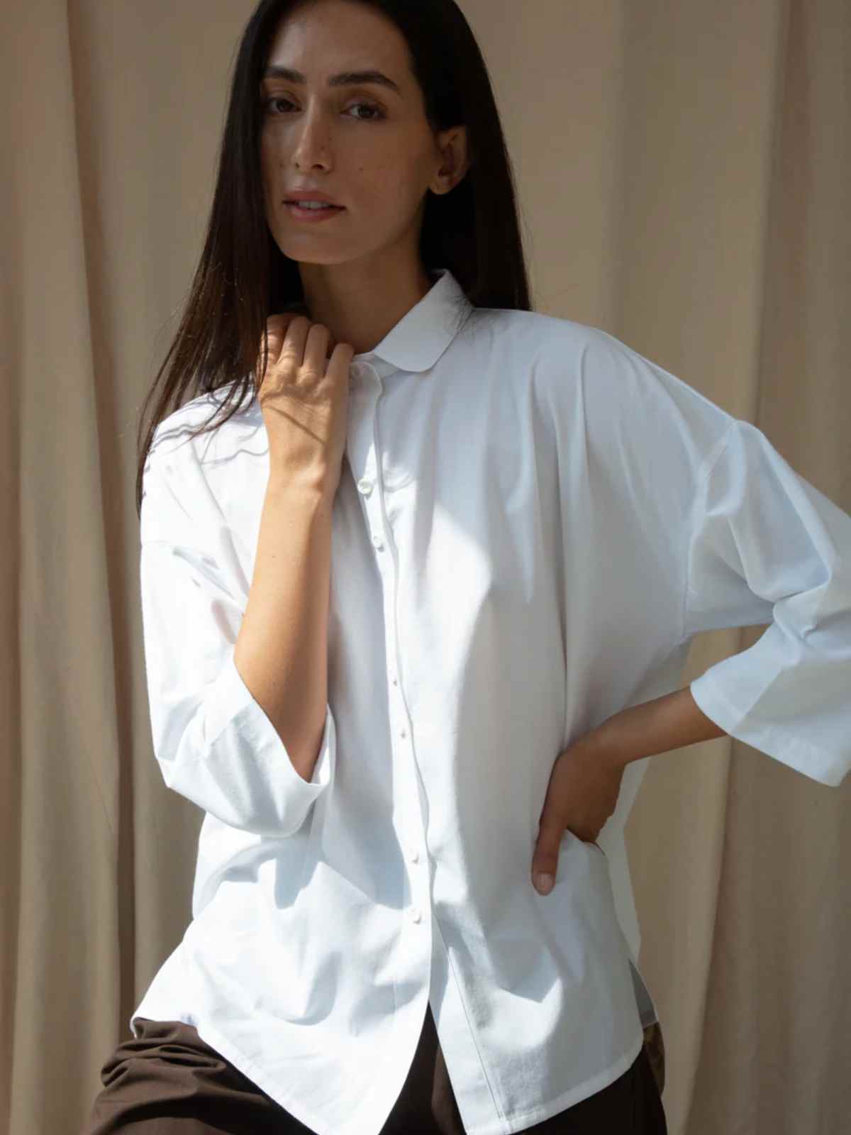 person wearing more sustainable white shirt from beaumont organic