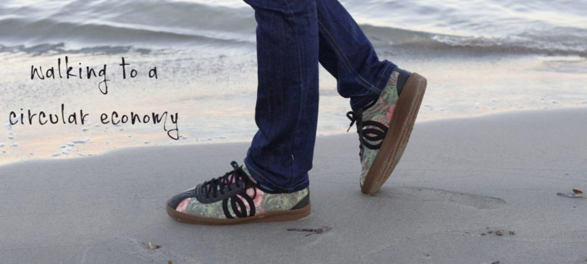 person walking on beach in sustainable shoes by Vesica Piscis