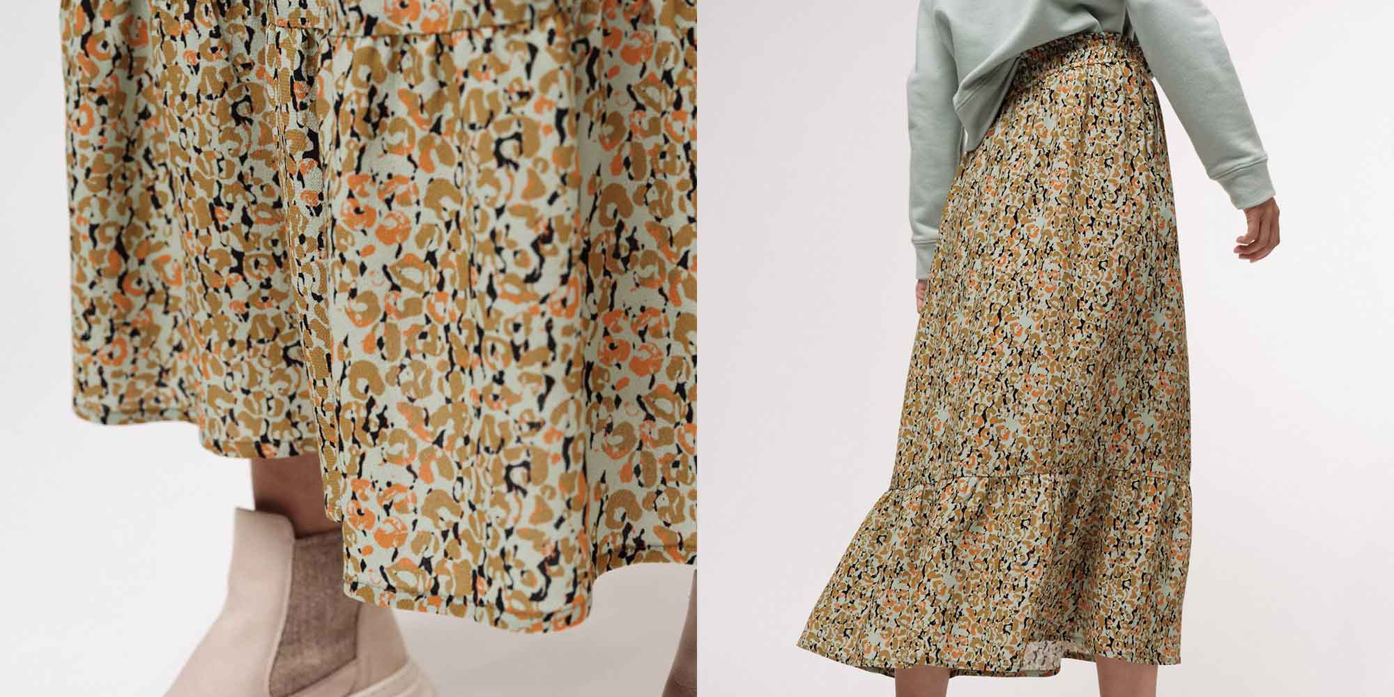 Close up of an animal print orange and cream long viscose skirt by LANIUS.