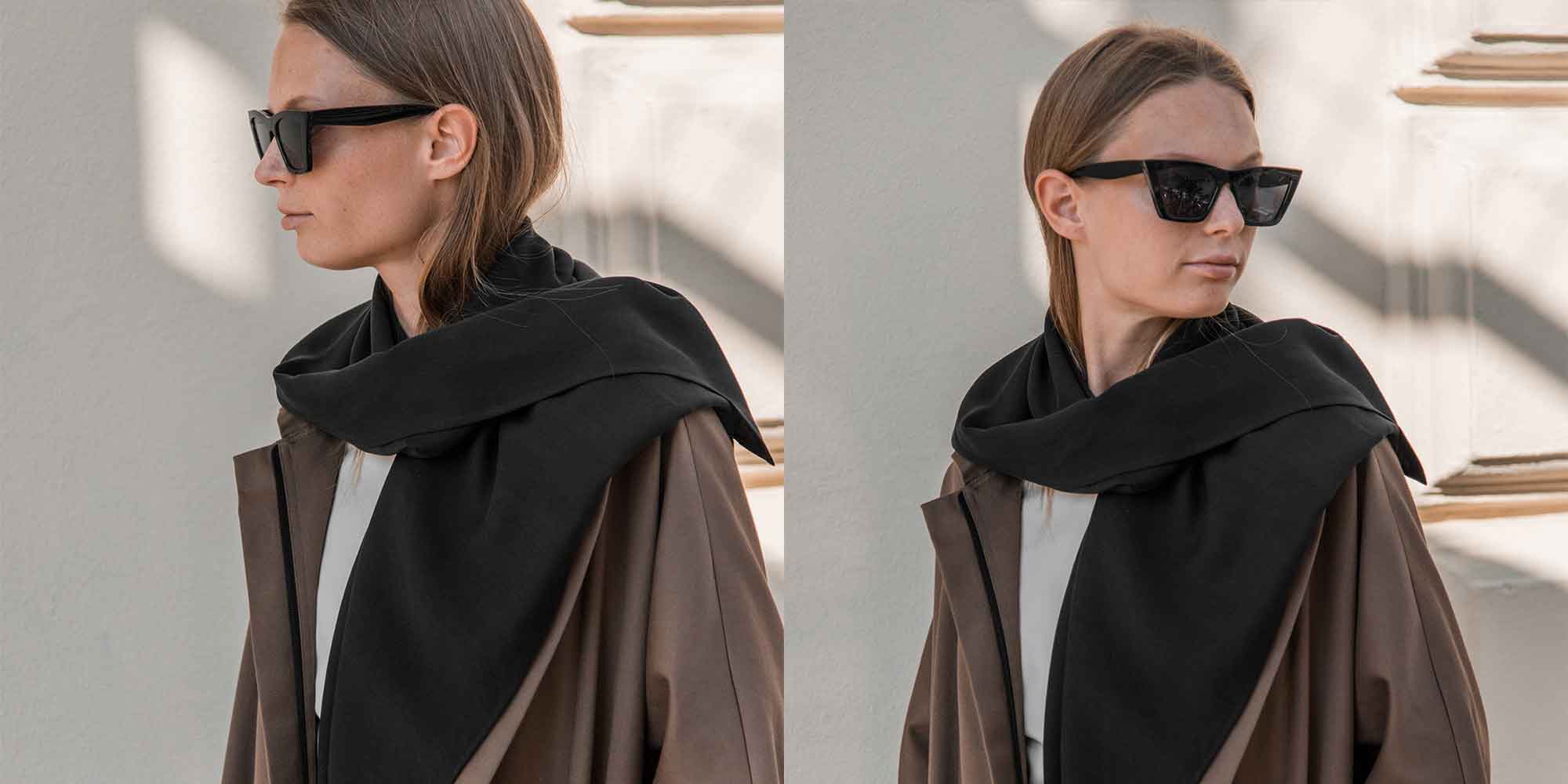 Someone wearing sunglasses outdoors wearing a black sustainable viscose alternative scarf by Mila.Vert.