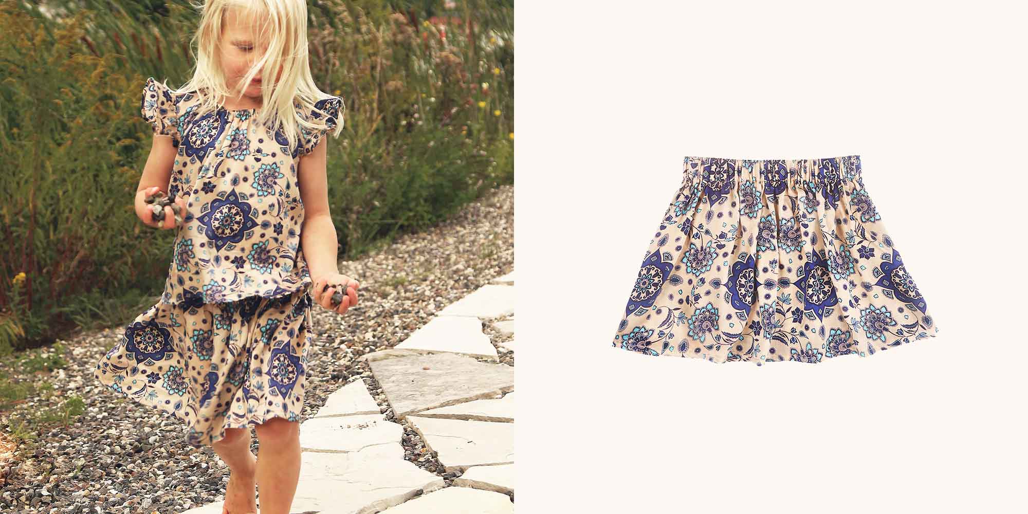 A child wearing a cream and navy blye viscose lyocell skirt by TAMGA Designs.