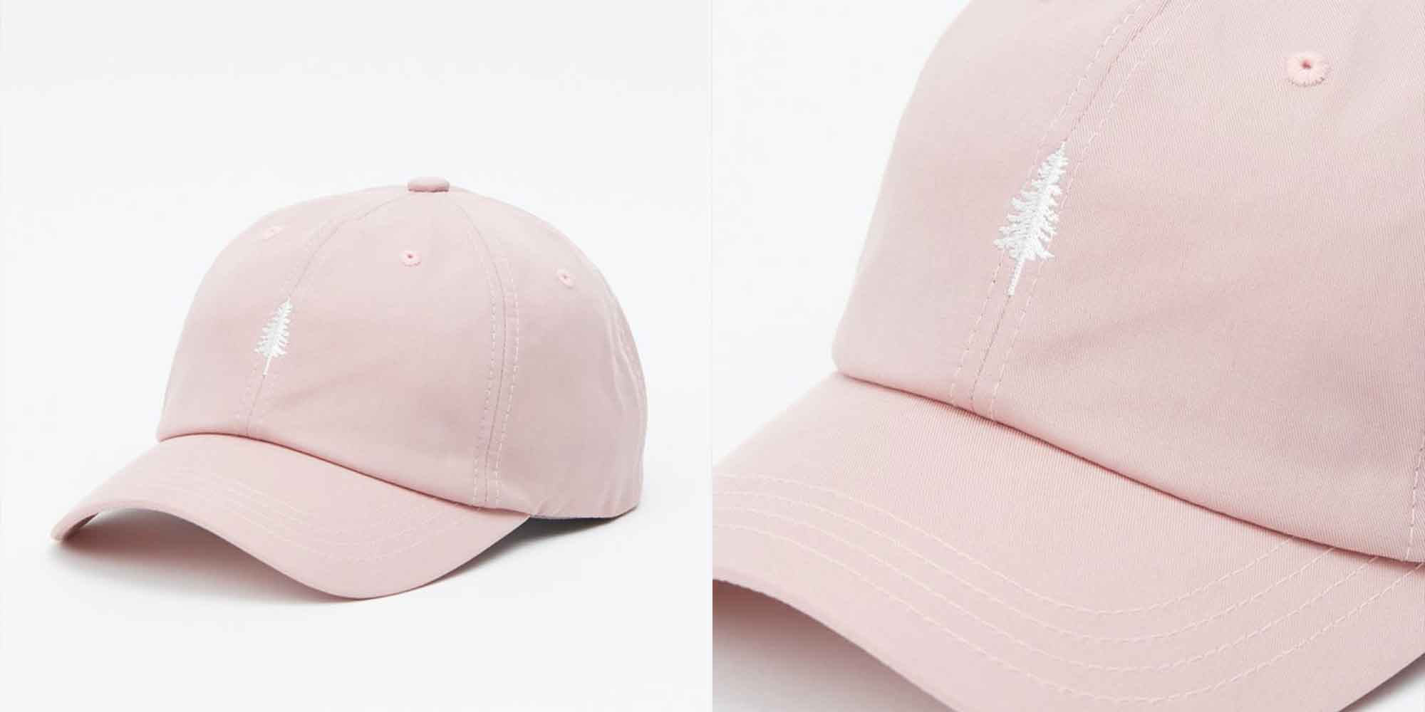 A pink lyocell cap with a white tree design, ethically made by tentree.
