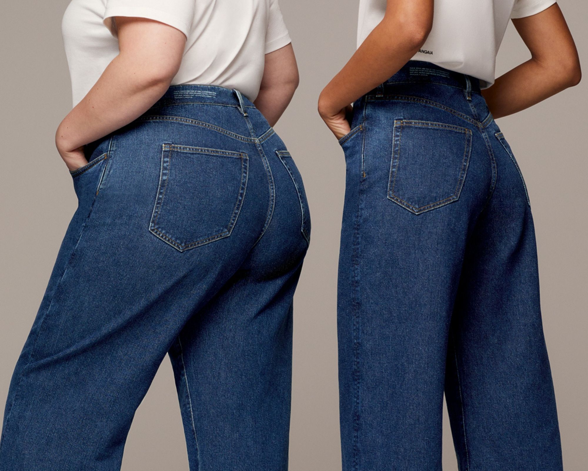 Two people of different body types standing side by side in dark blue denim wide leg jeans sustainably custom made by unspun x PANGAIA.