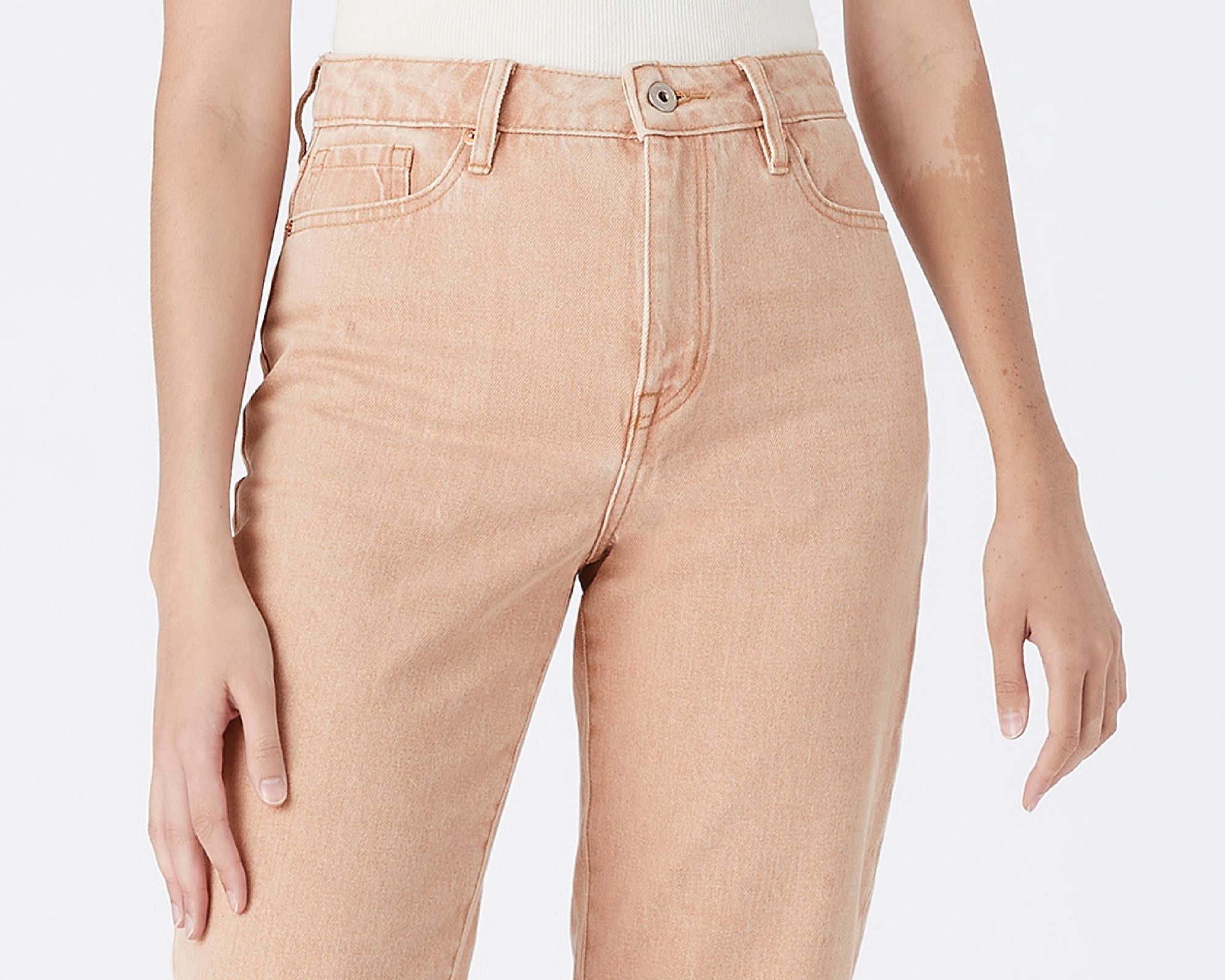 Cropped shot of peach pink clay dyed organic jeans by Outland Denim for the Grounded Collection.