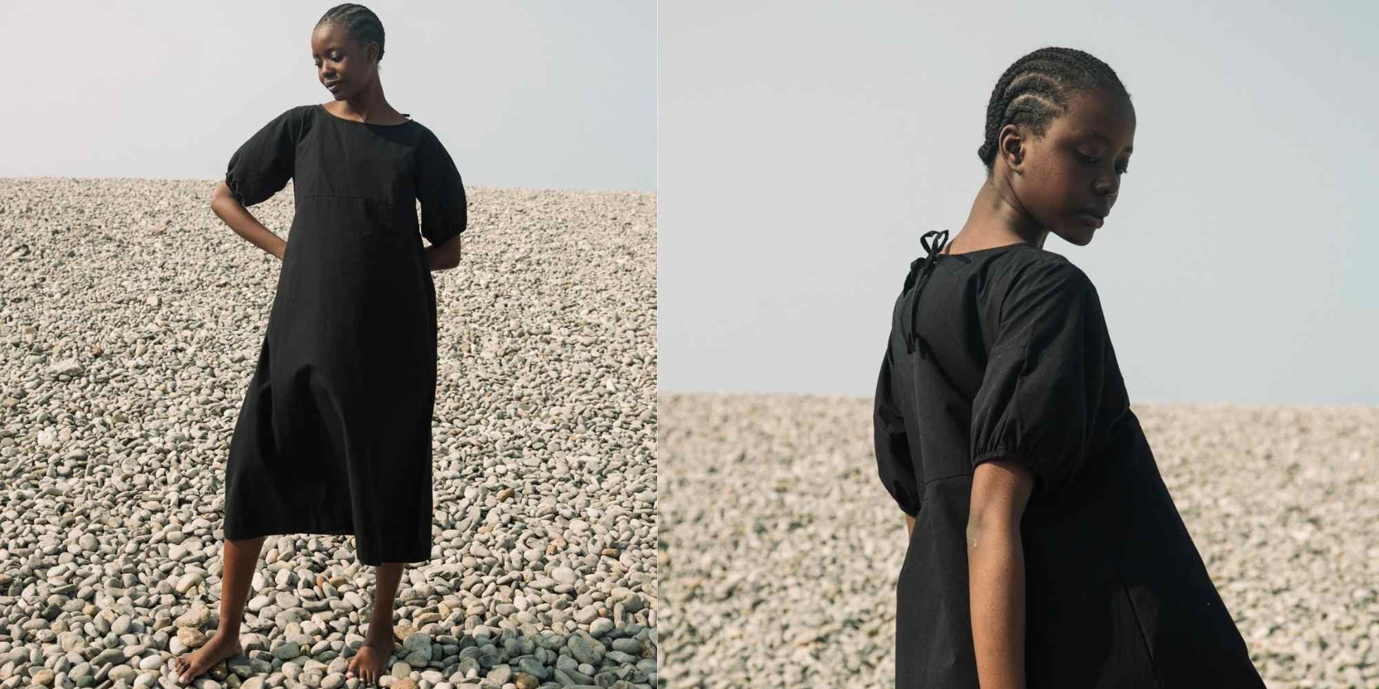 woman wearing black puff sleeve organic cotton midi dress