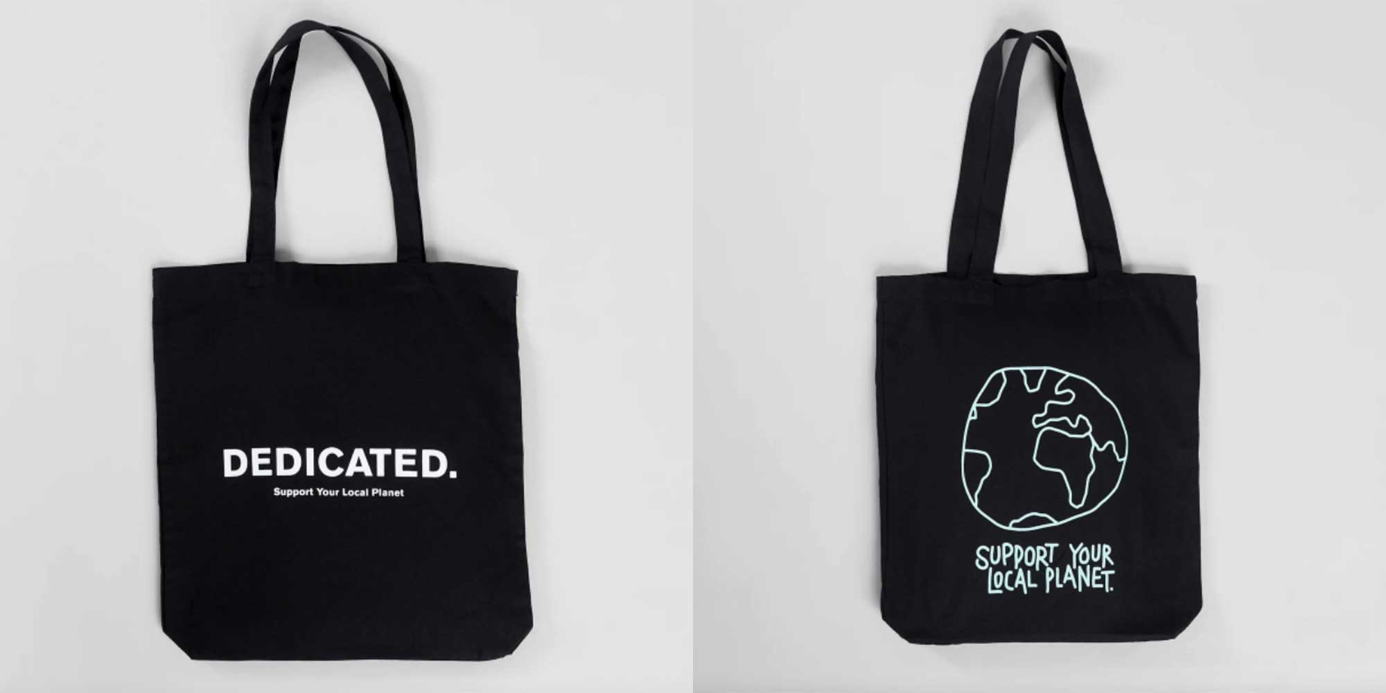 A black canvas tote bag by Dedicated.