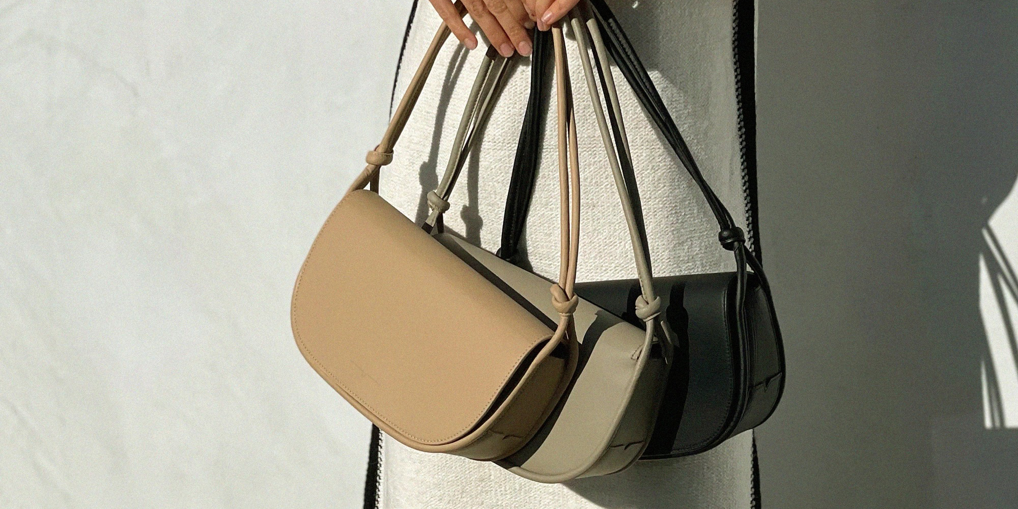 A woman carrying baguette bags.