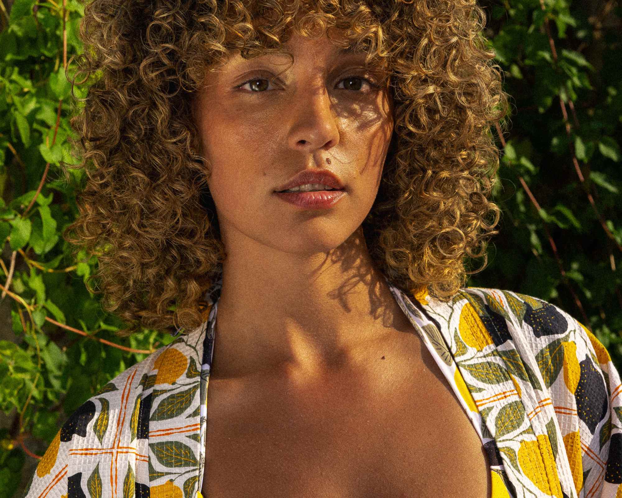 person wearing lemon print clothes from Dedicated