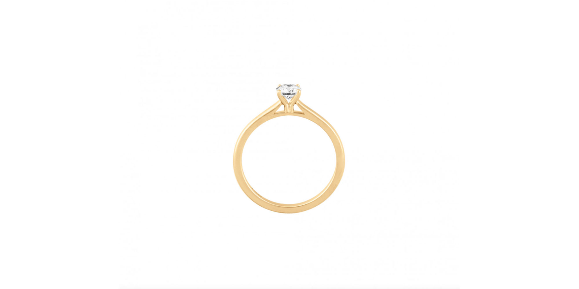 A classic gold solitaire engagement ring by Courbet.