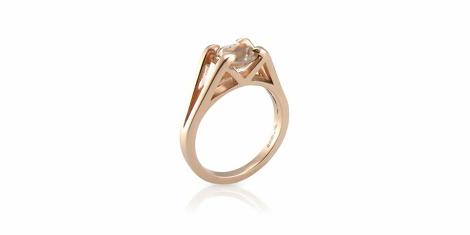 A minimal gold ethical engagement ring by Untold Jewellery.