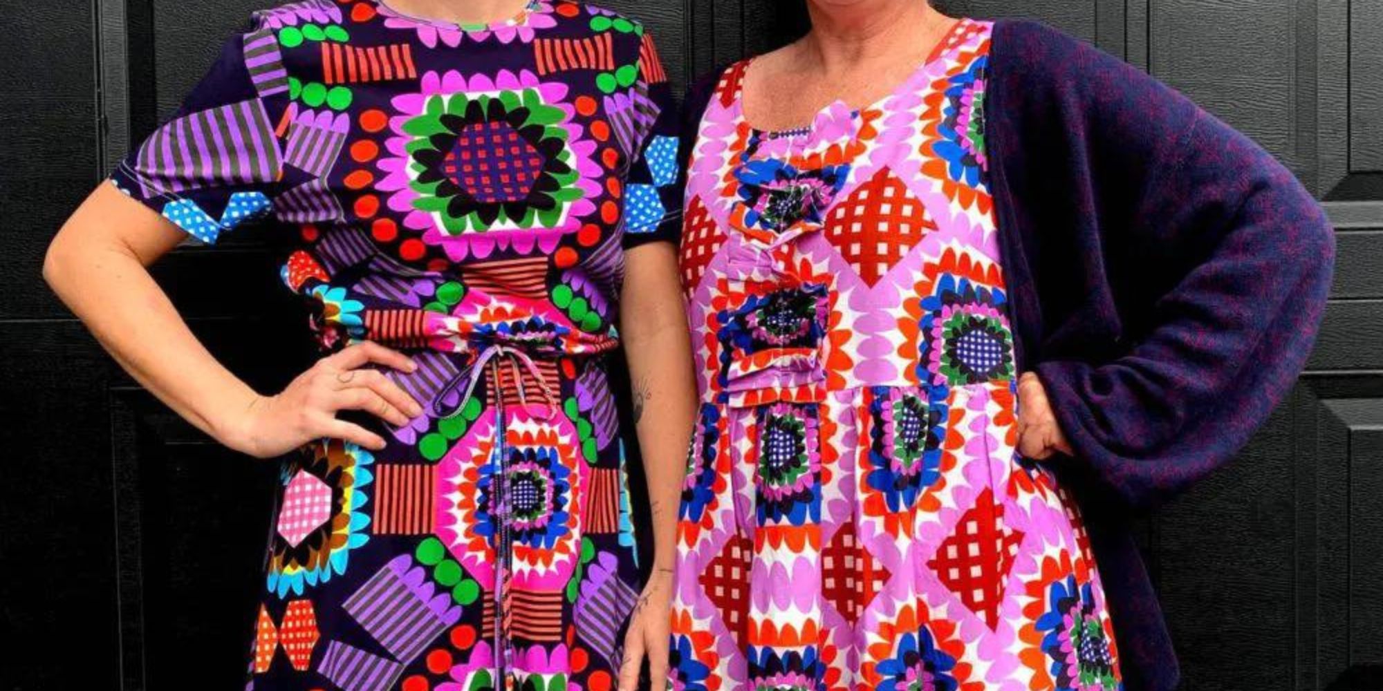 Two people wearing colourful locally made Doops Designs dresses.