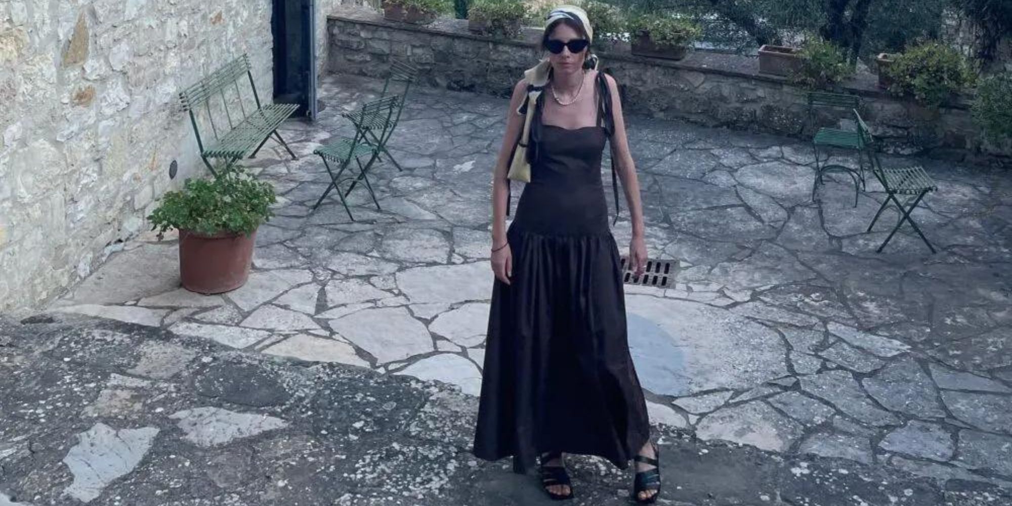 A full length black dress made by Par Moi.