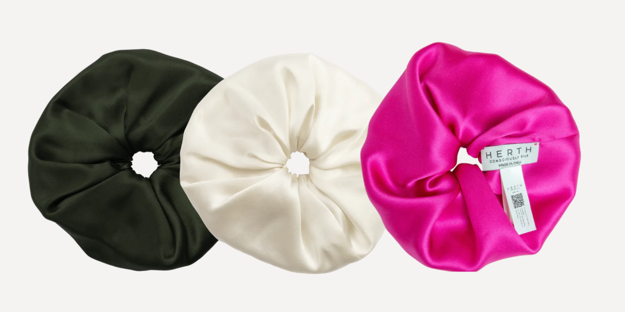 A black, white and hot pink organic silk scrunchie by HERTH.
