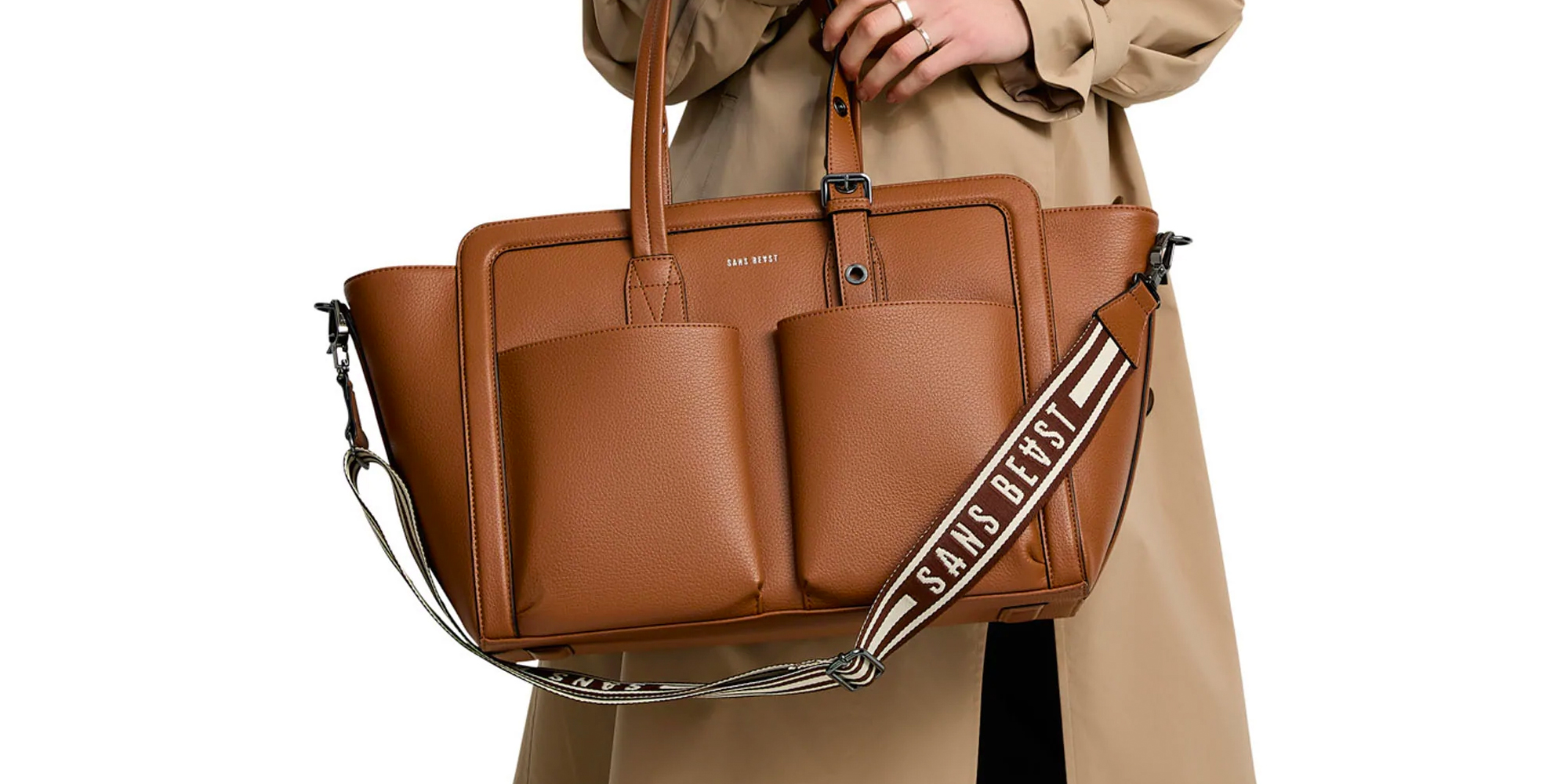 A woman carrying a cinnamon-coloured tote by SANS BEAST.