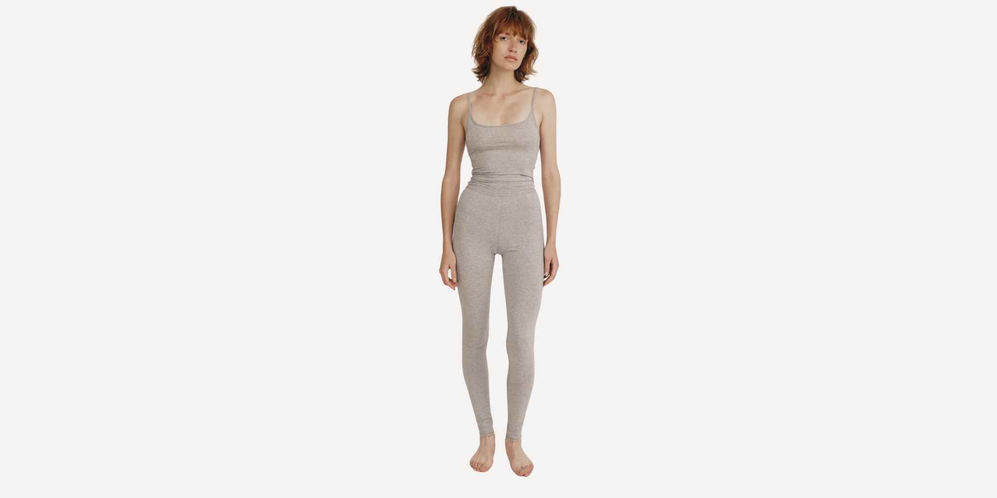 person wearing greay leggings and top from organic basics