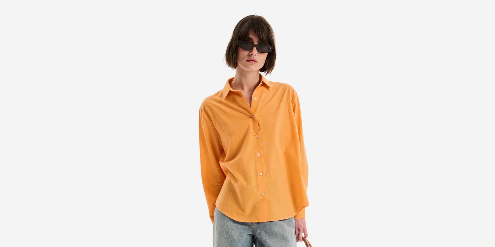 person wearing orange shirt from omnes