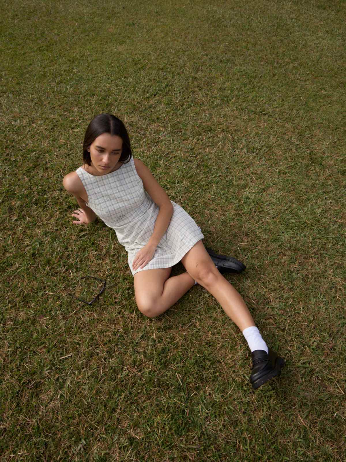 person wearing checked dress from afends