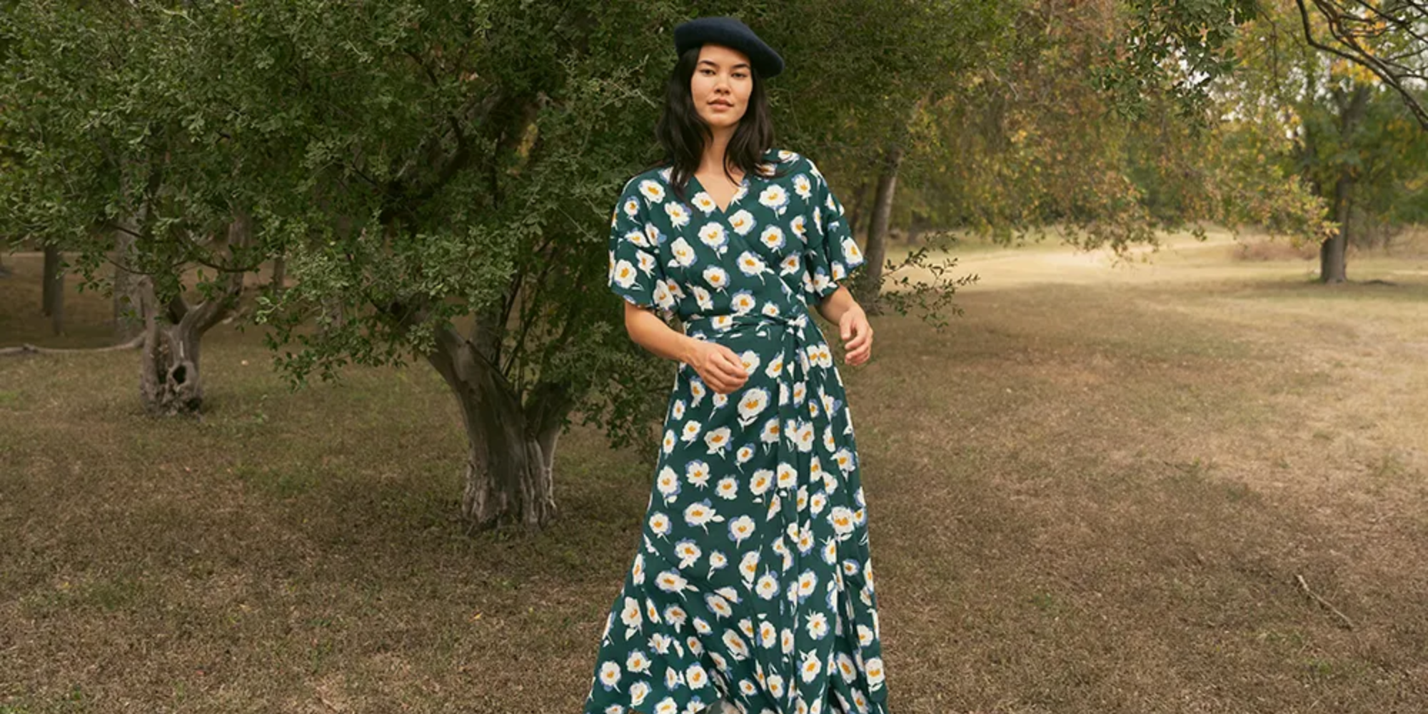 Someone in field wearing floral maxi dress by HarperSage.