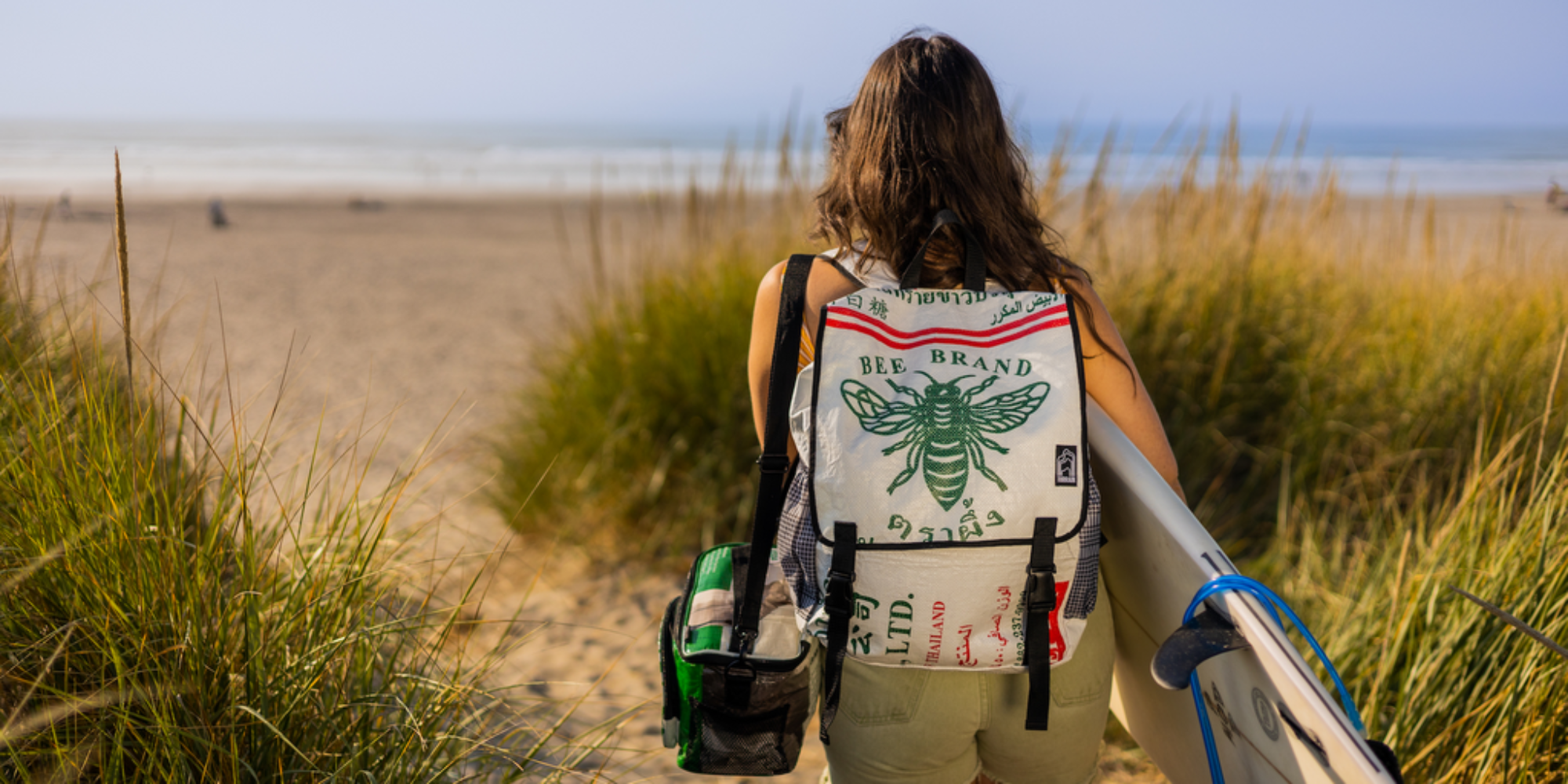 Someone at the beach wearing backpack by Torrain.