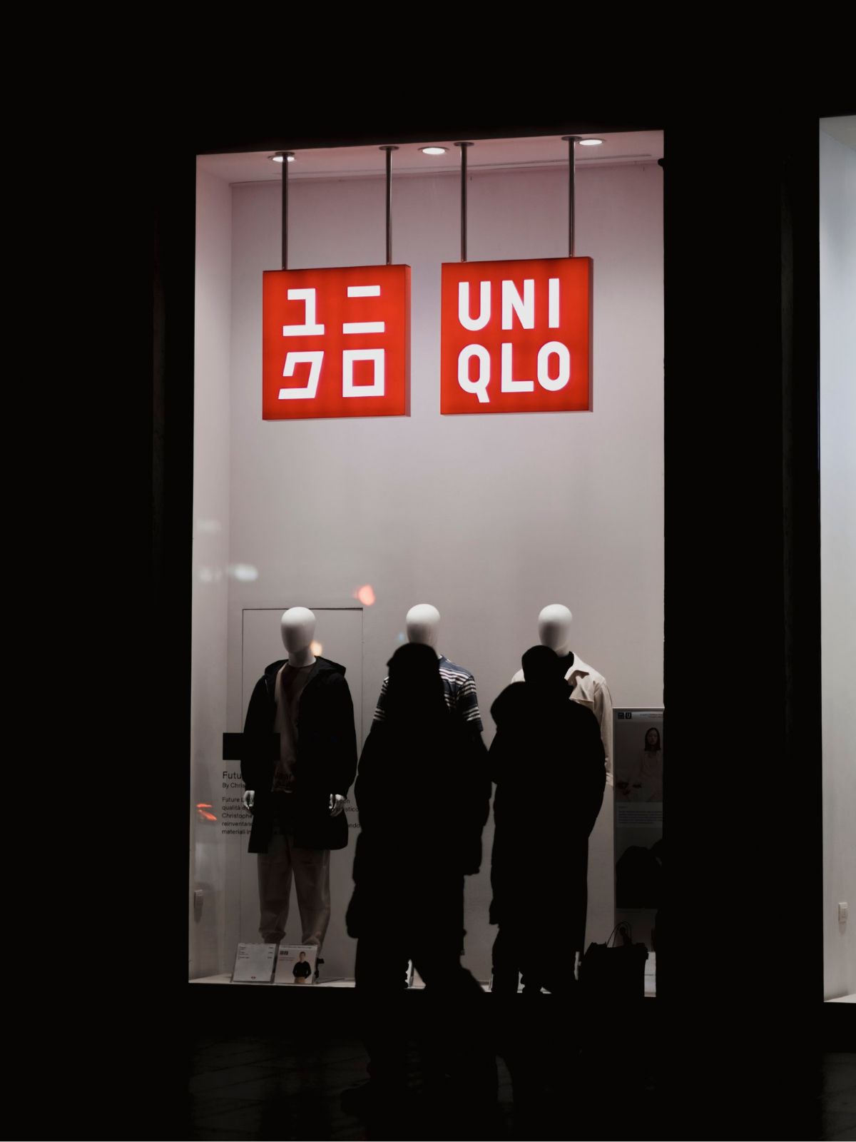 uniqlo storefront lit up at night