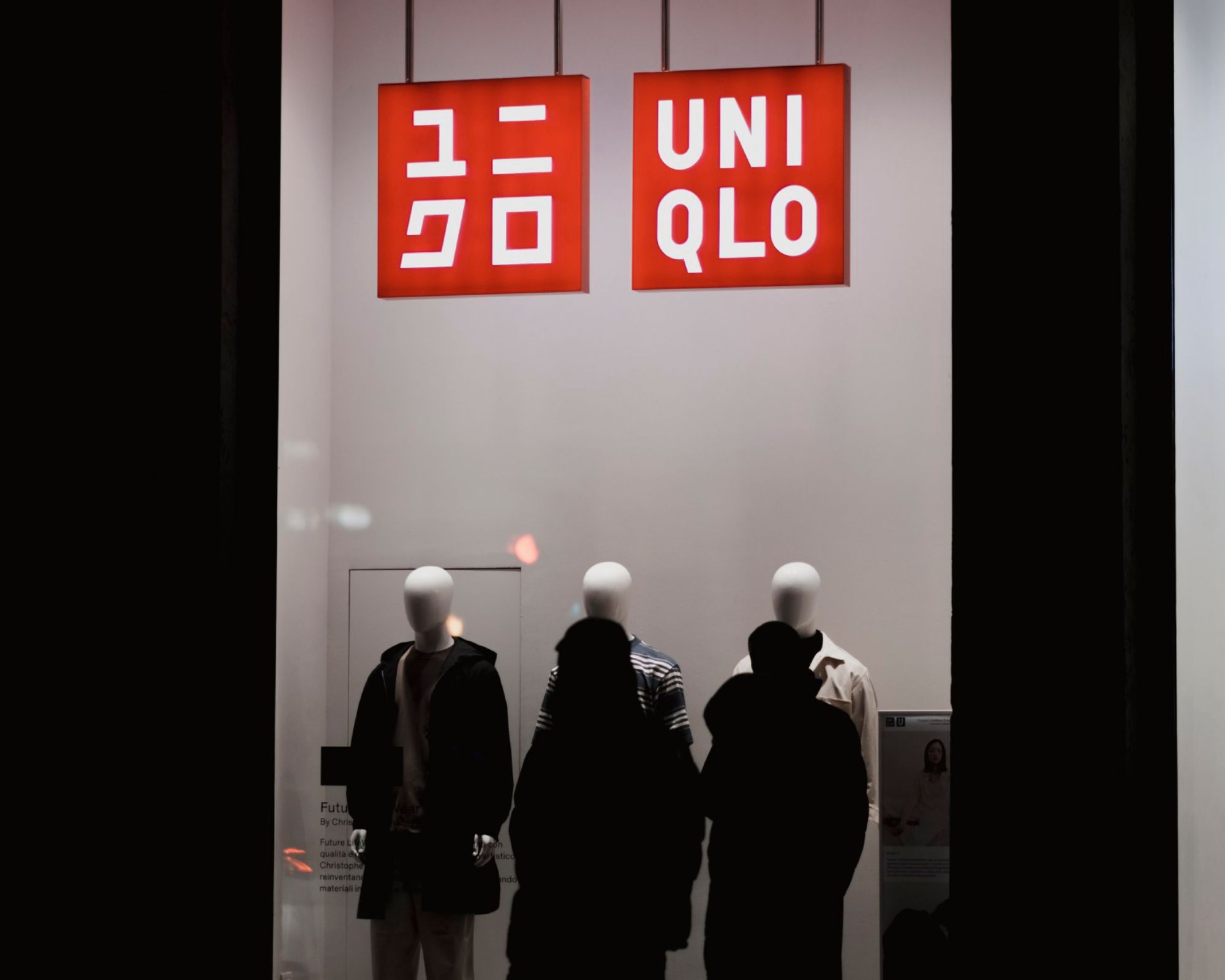 uniqlo storefront lit up at night
