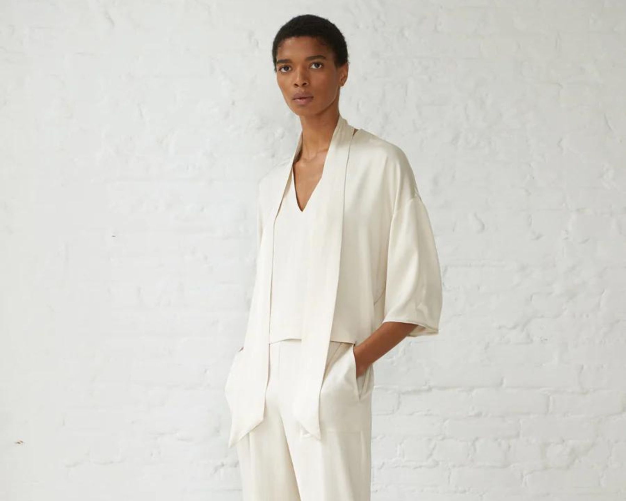 A cream vegan silk top and pants as an unconventional wedding outfit responsibly-made by Minimalist.