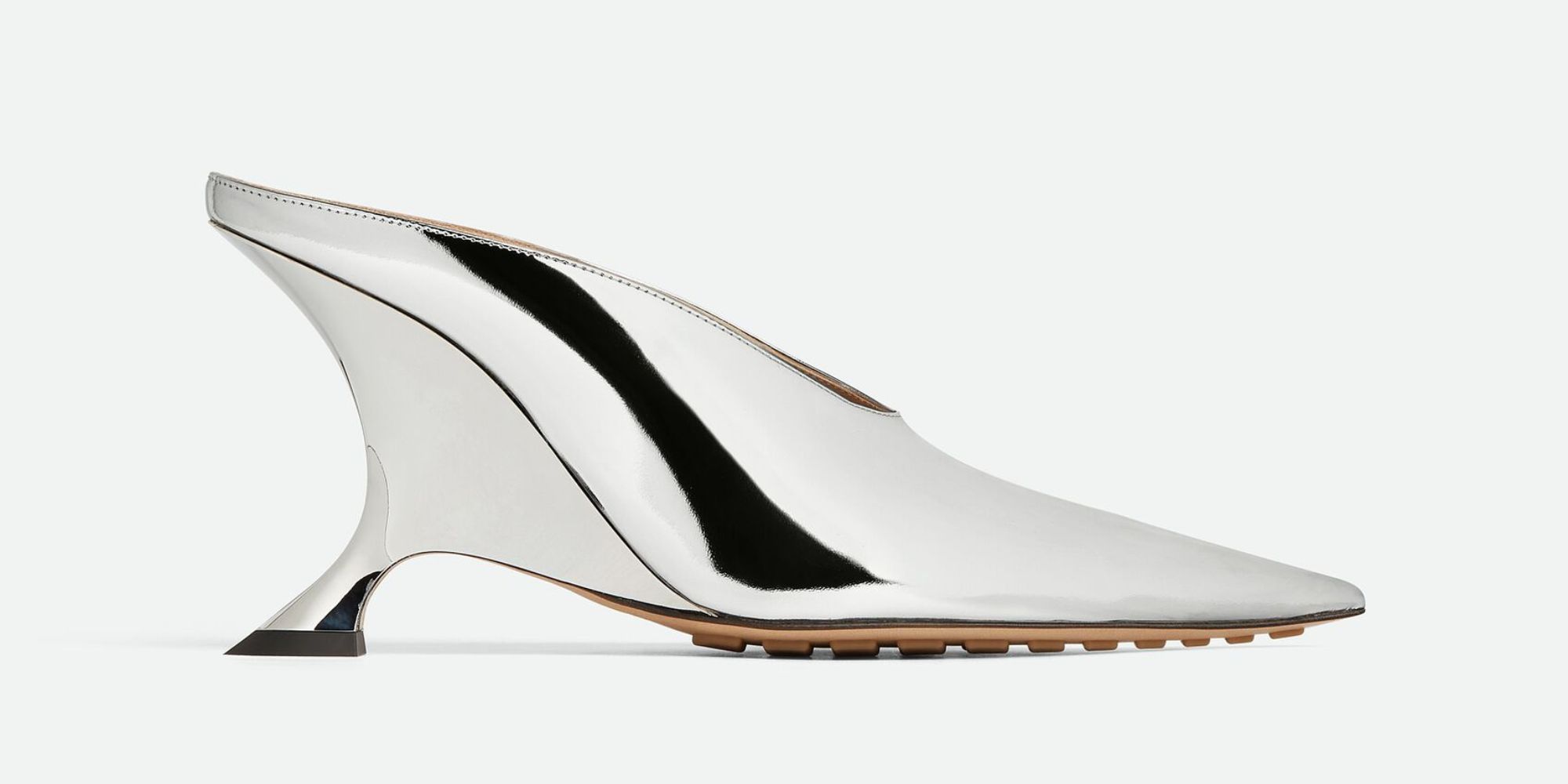 Futuristic silver mules made by Bottega Veneta.