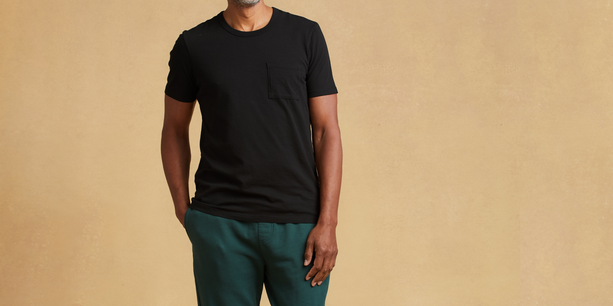 Someone in black t-shirt and bottoms by Classic T-Shirt Company.