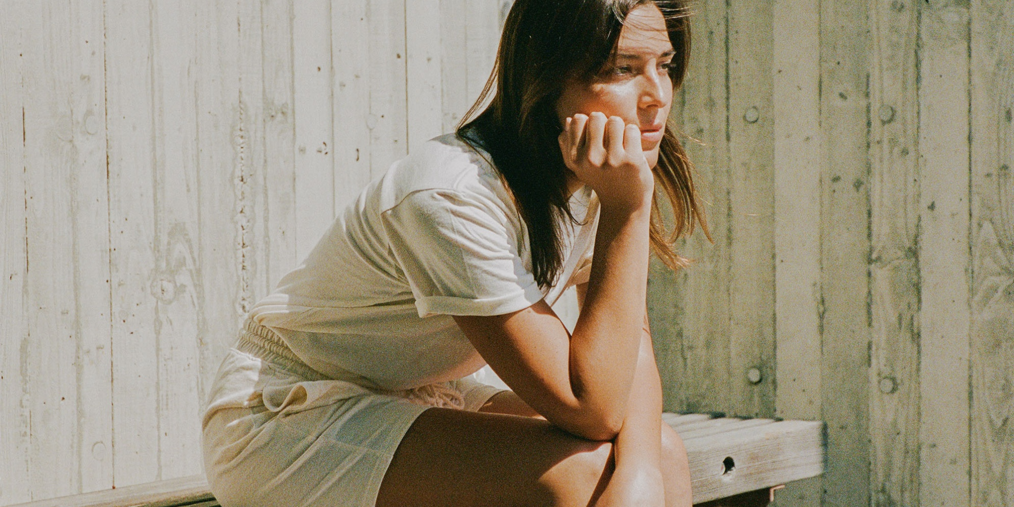 Someone in top and shorts by Harvest & Mill.