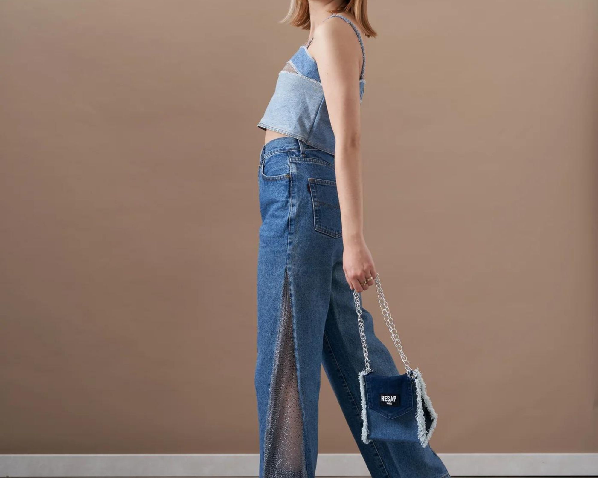 Upcycled denim split side jeans and handbag by RESAP Paris.