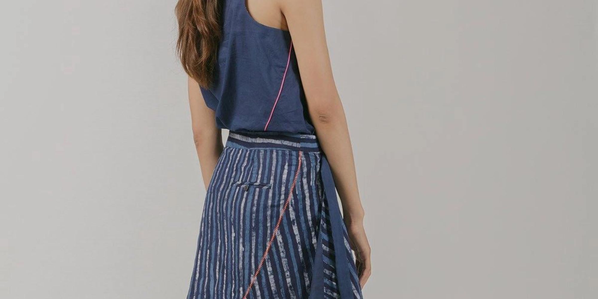 A blue and white wrap skirt made in-house by Vietnamese brand Kilomet09.