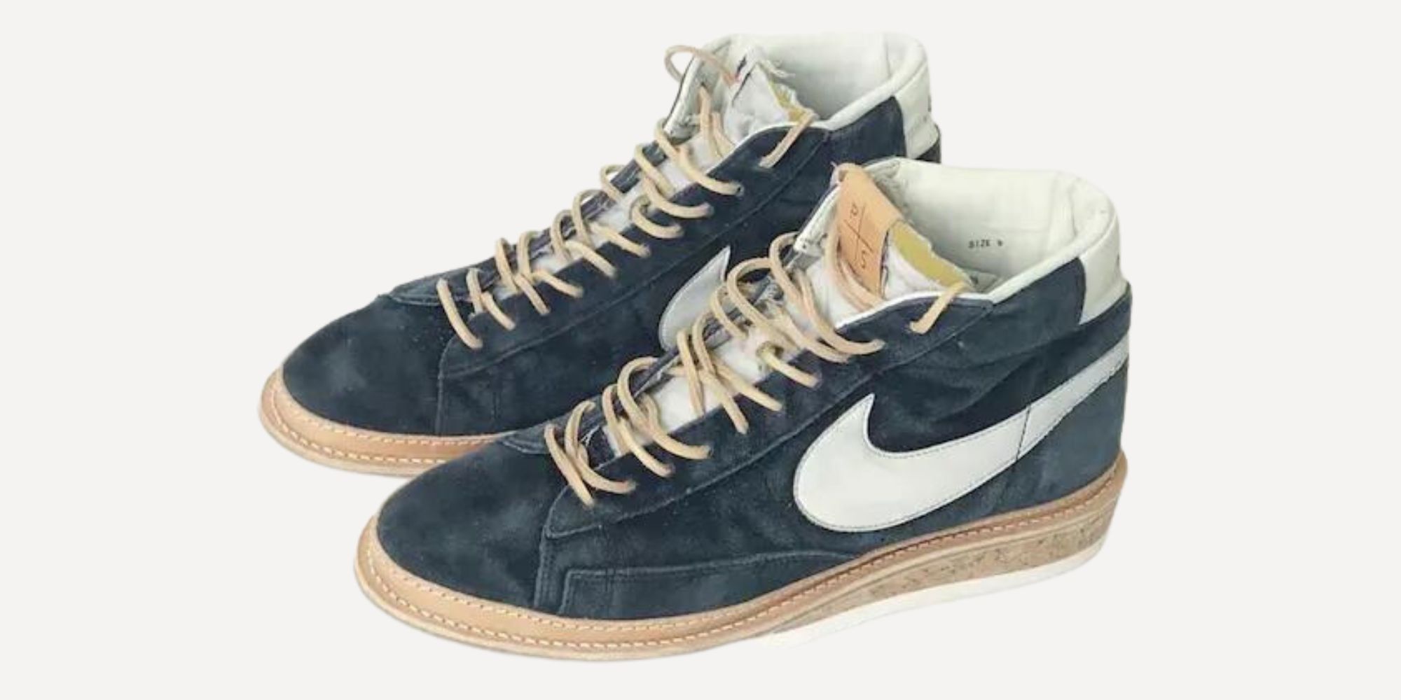 An old pair of Nike shoes resoled by PETERSON STOOP.