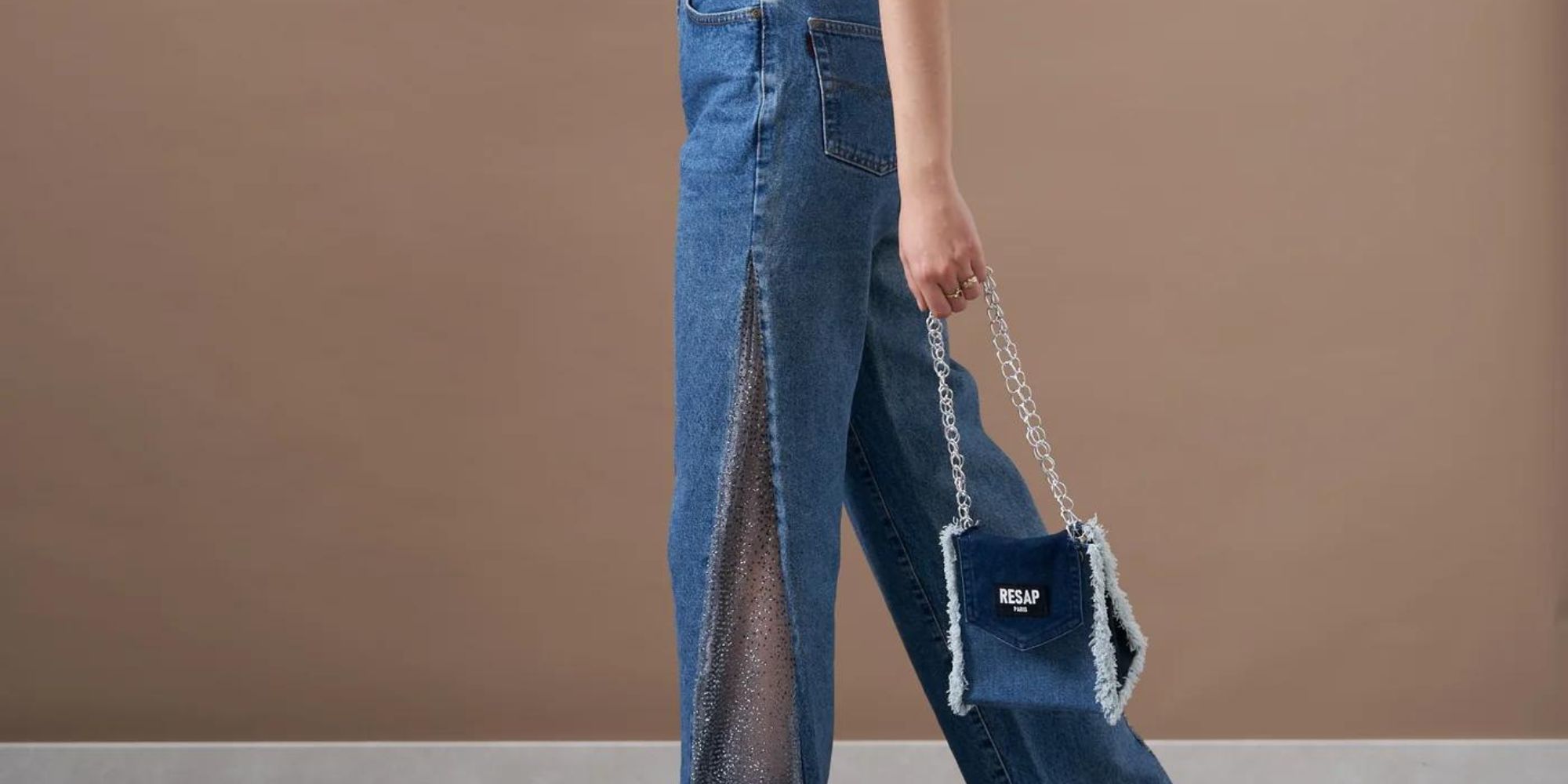 Upcycled denim split side jeans and handbag by RESAP Paris.