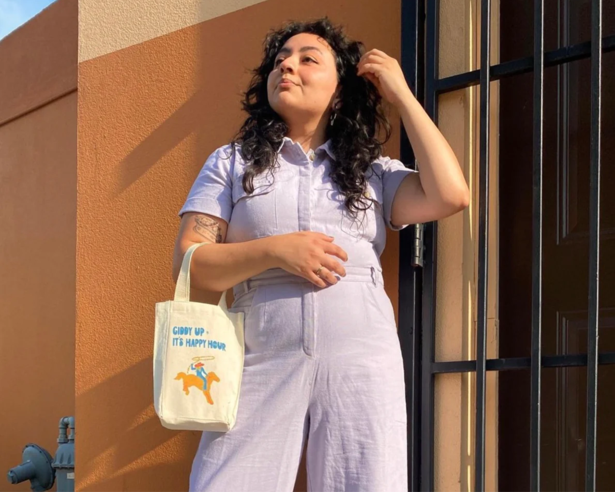 Someone in responsibly-made cotton jumpsuit by Harpersage.