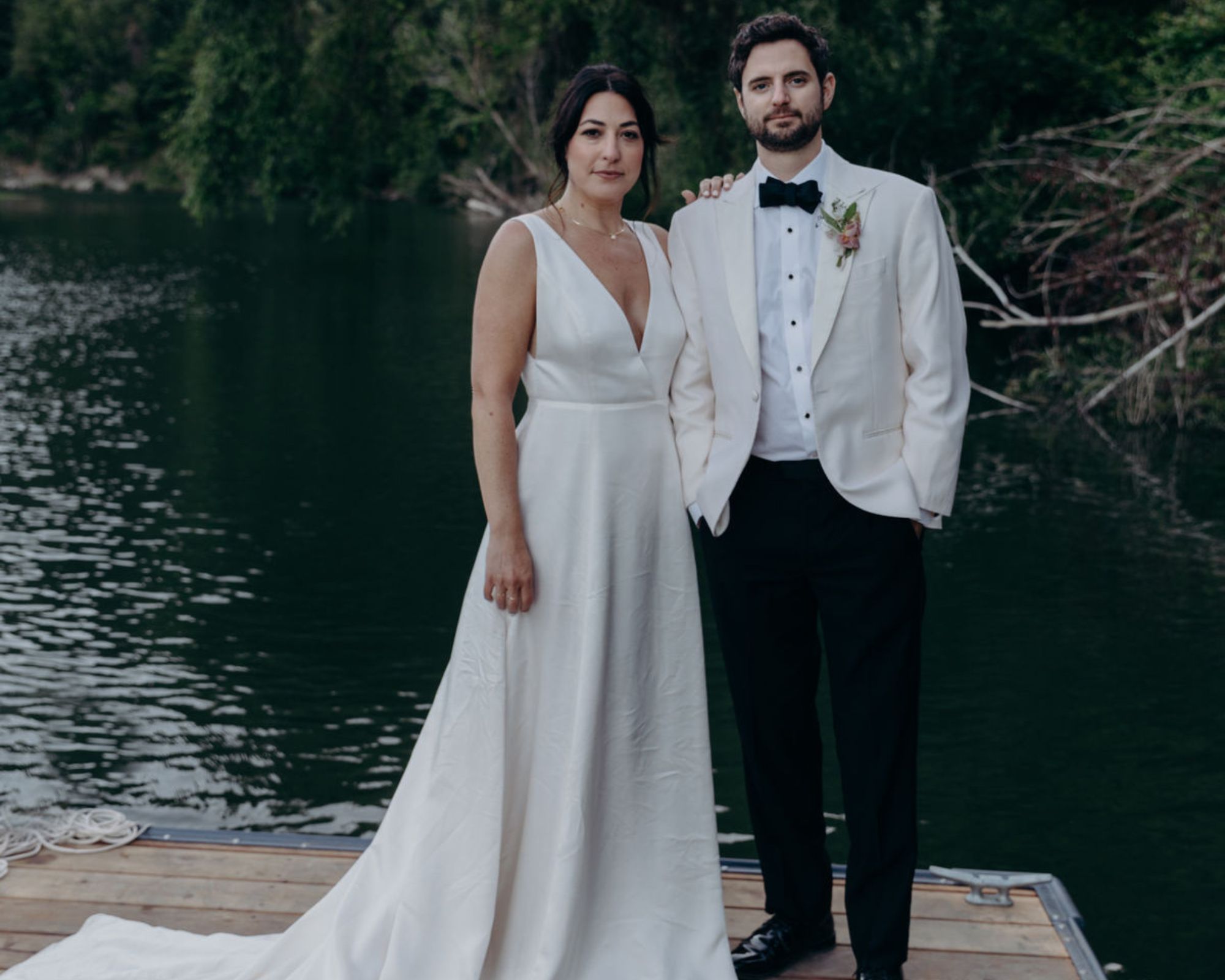Whimsy + Row founder Rachel and her now-husband Steven in their responsibly-sourced wedding clothes on their wedding day surrounded by nature.