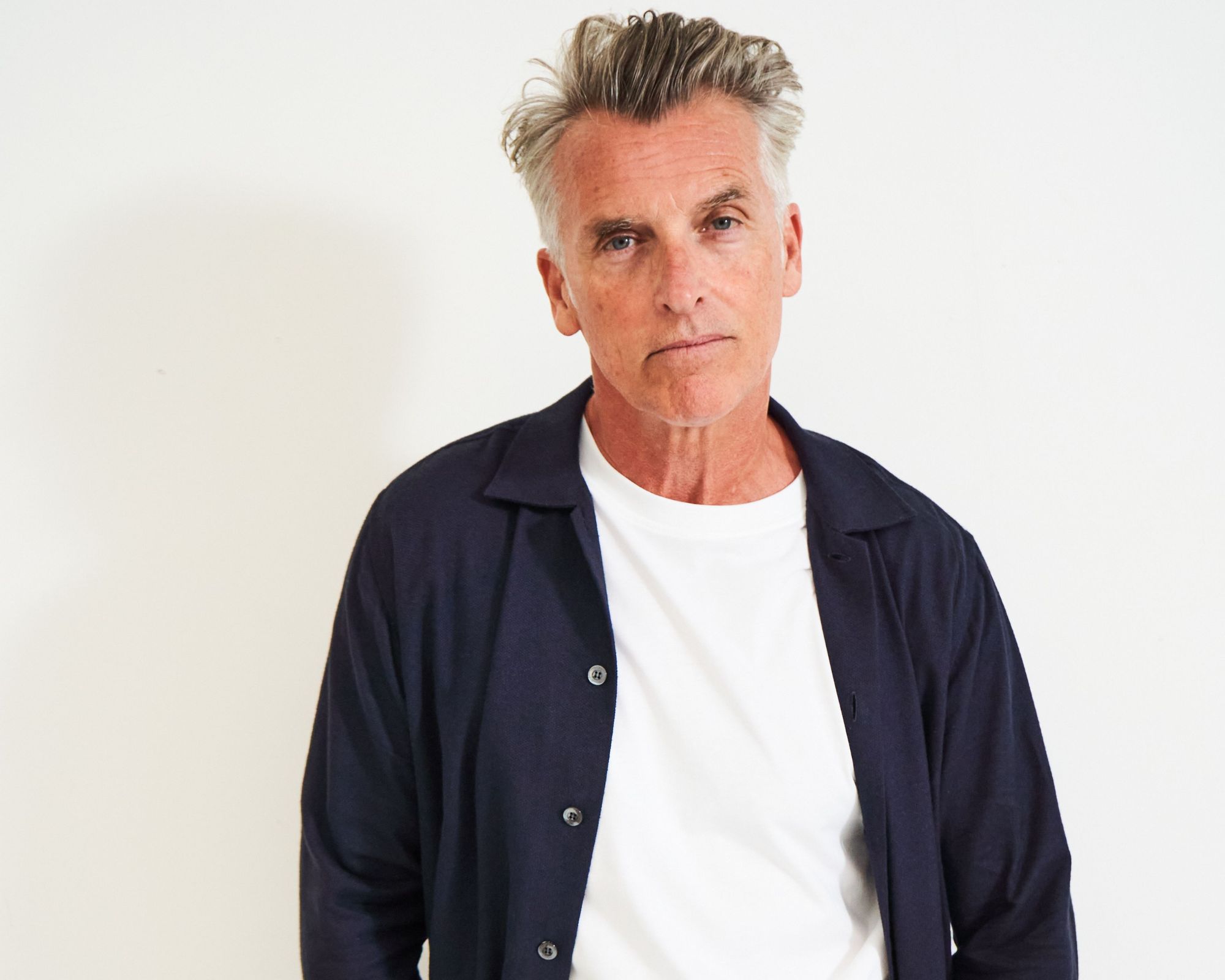 A navy blue regenerative and organic cotton menswear overshirt designed with care by Neem.