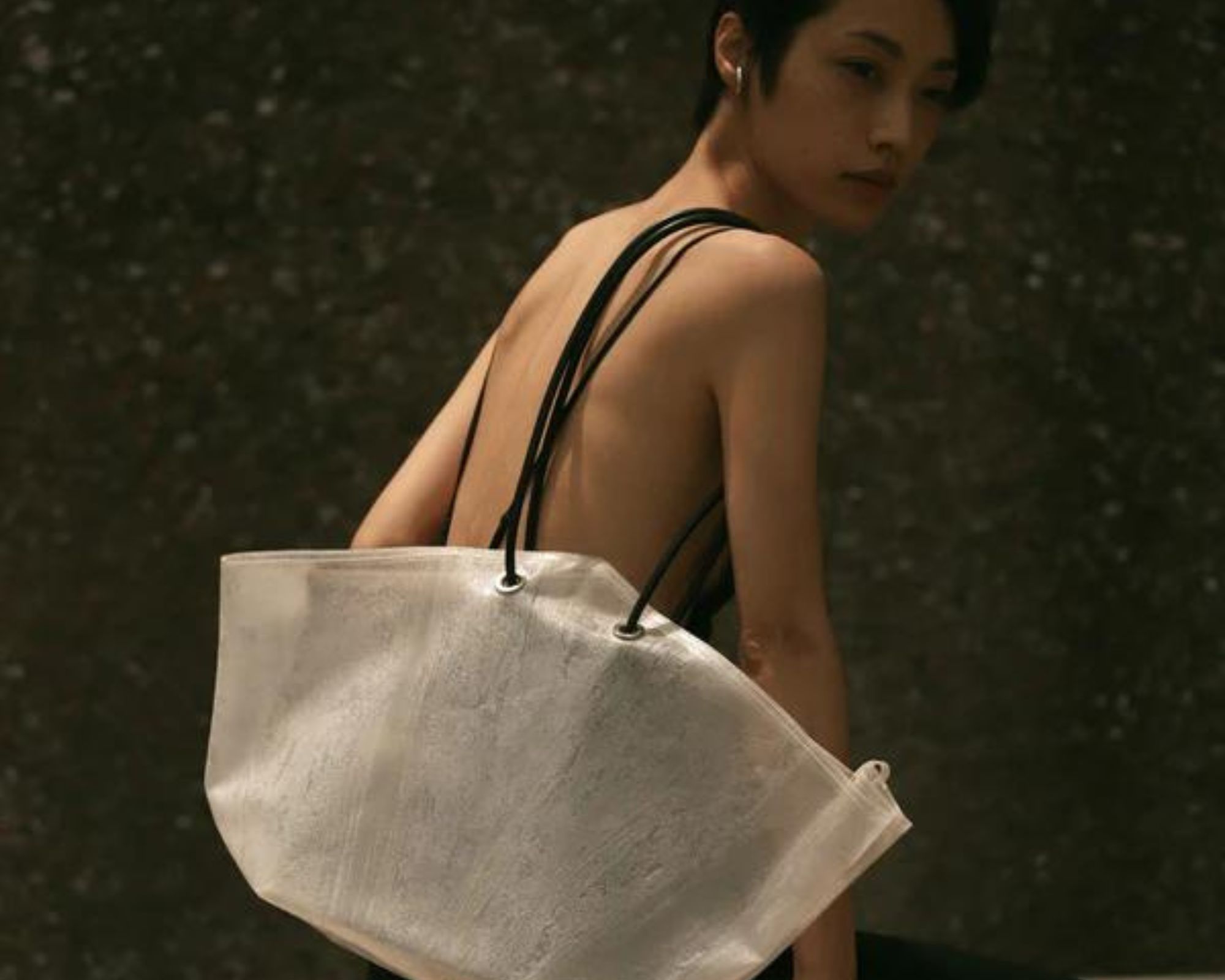 An upcycled umbrella clear tote bag made by PLASTICITY.