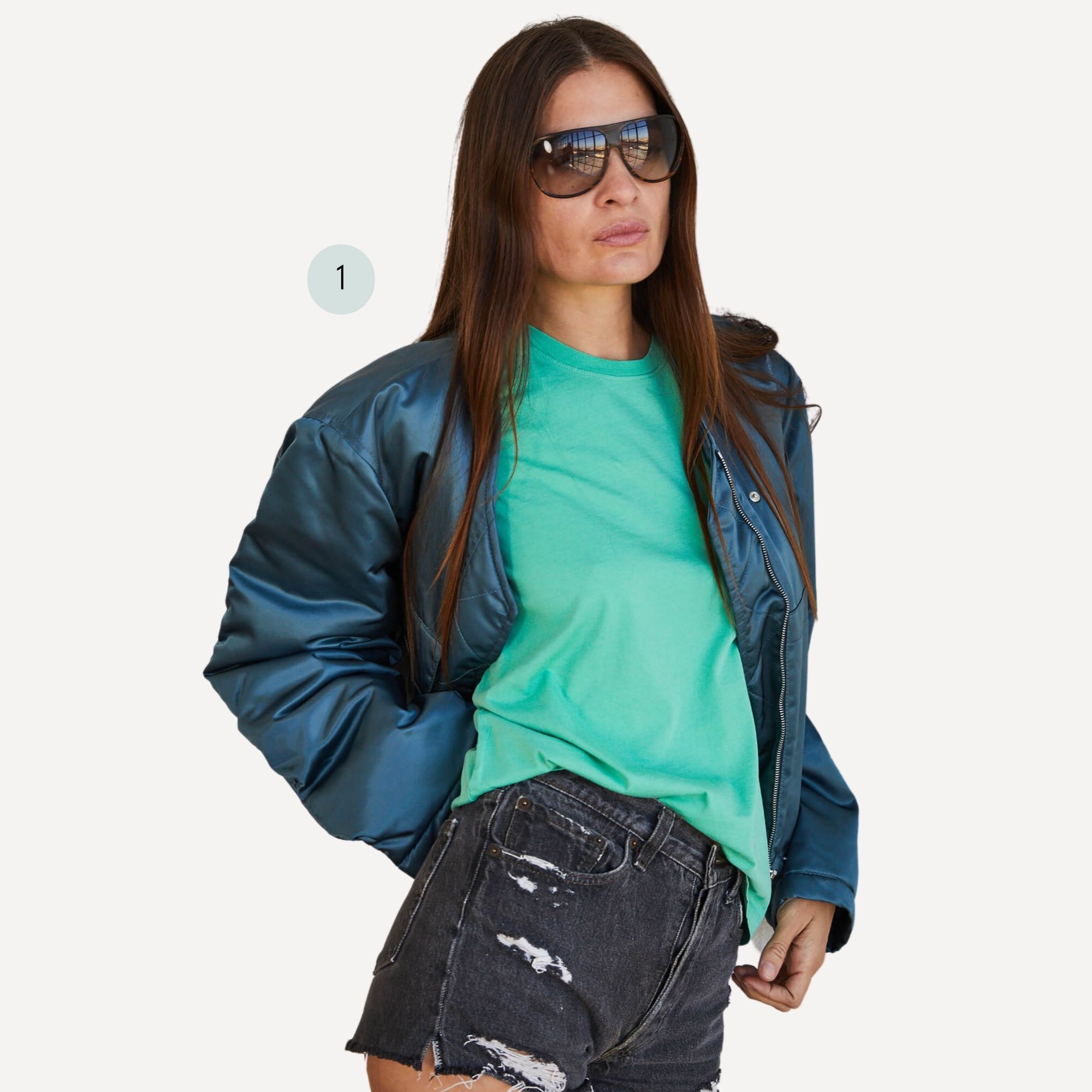 A boyfriend look with a light green organic cotton t-shirt by The Classic T-Shirt Company paired with a bomber jacket and shorts.