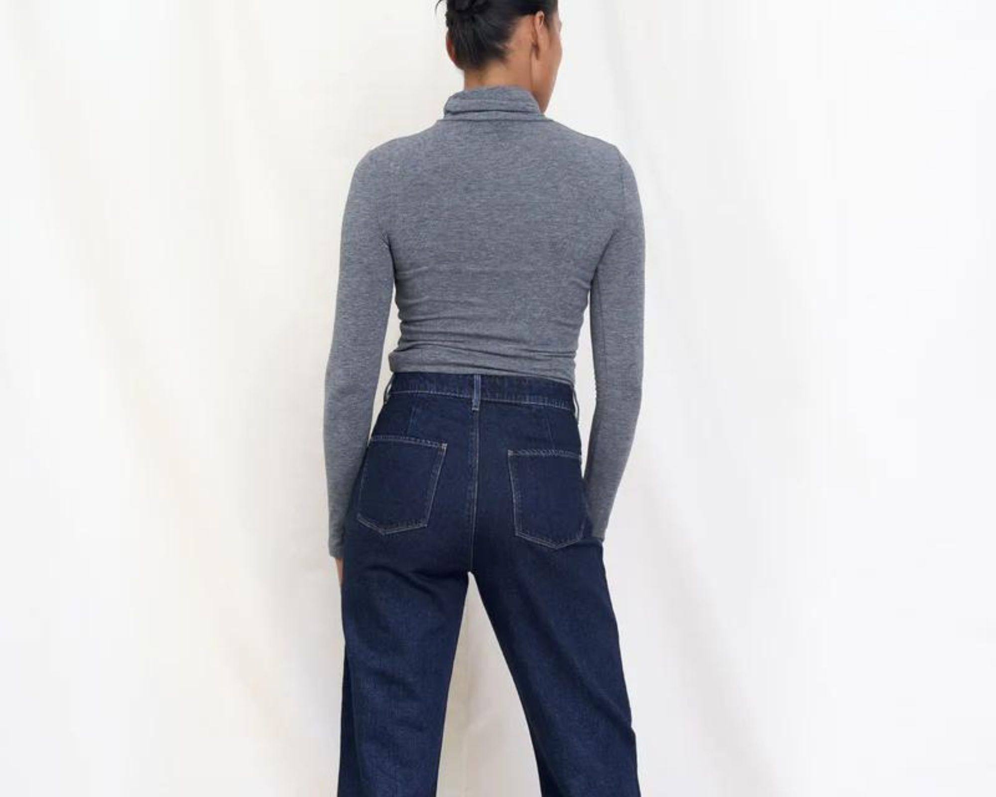 A pair of mid wash straight leg denim jeans by DAWN Denim.