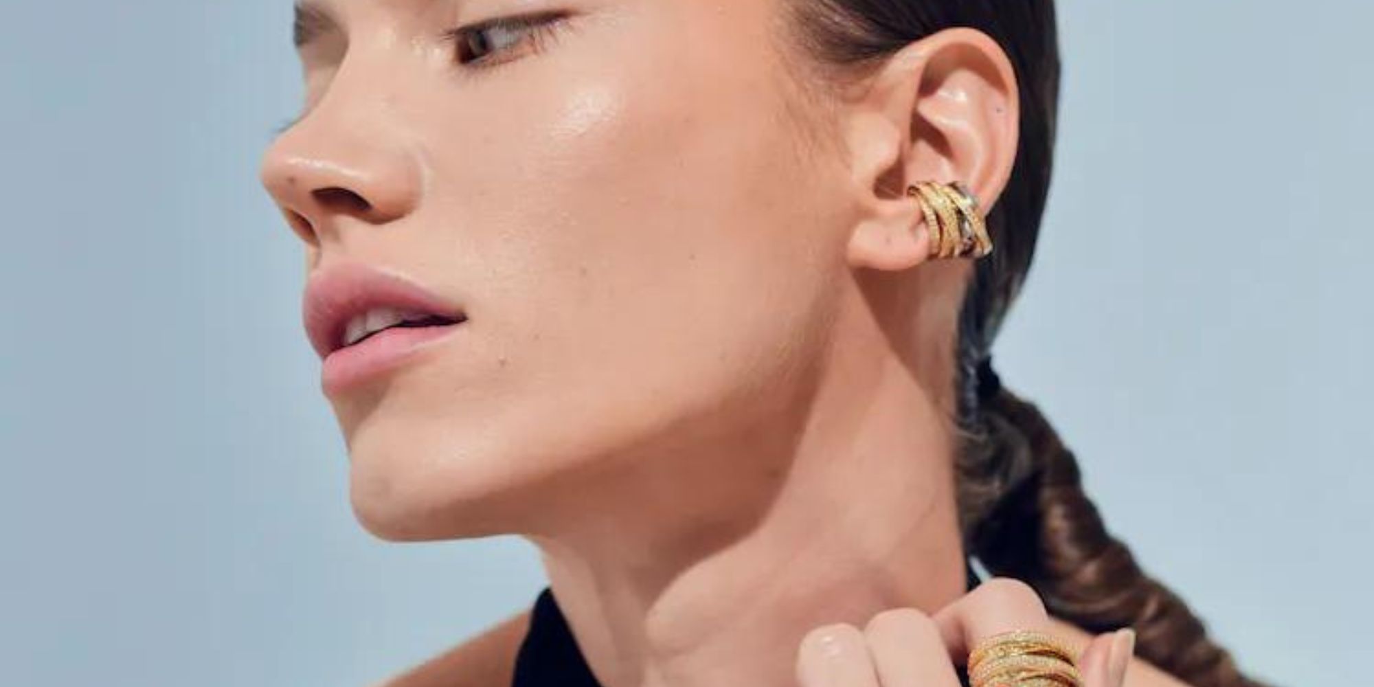 A model wearing Norwegian fine jewellery made by Tom Wood.