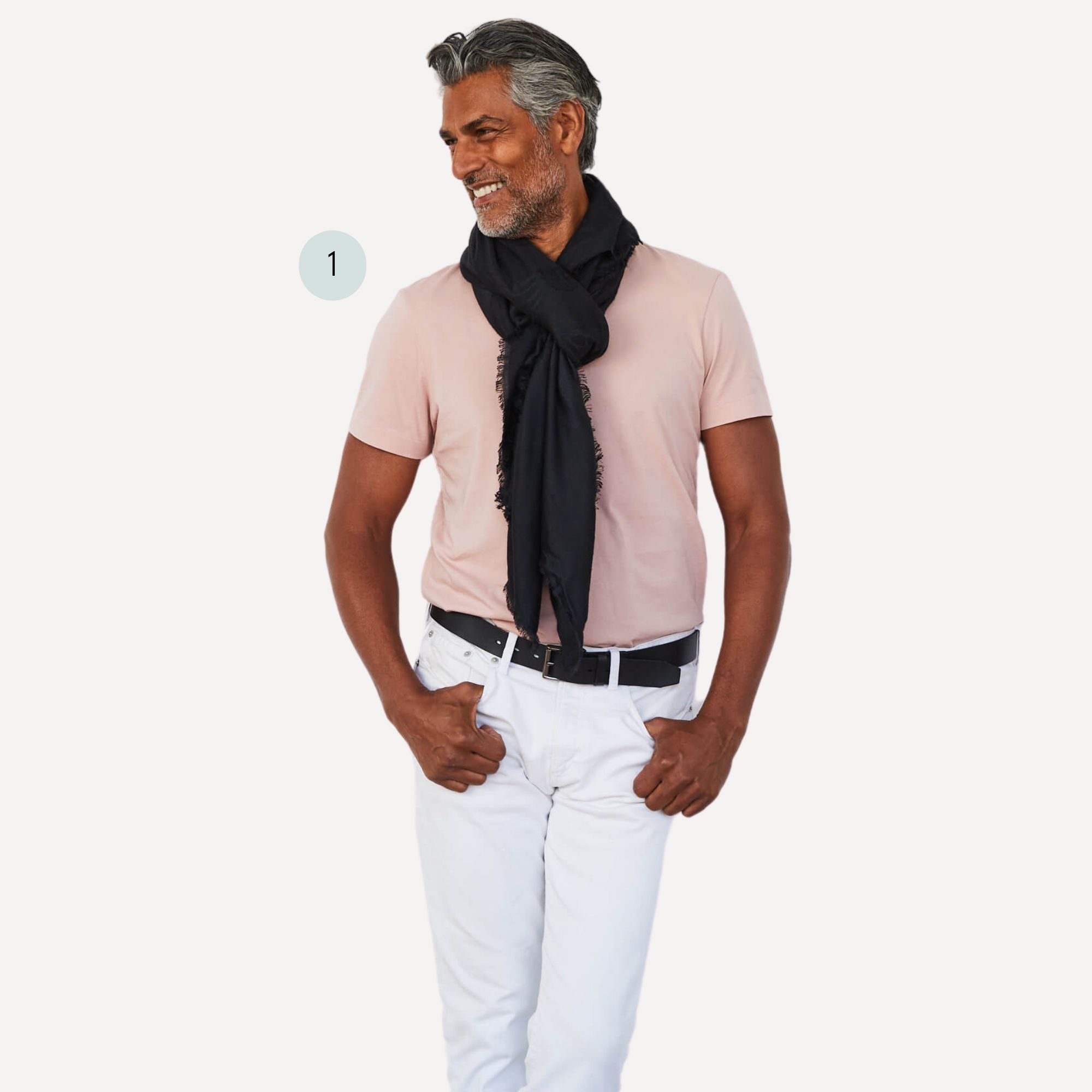 A business casual menswear look pairing a blush pink men's tee by The Classic T-Shirt Co with a black scarf and white jeans.
