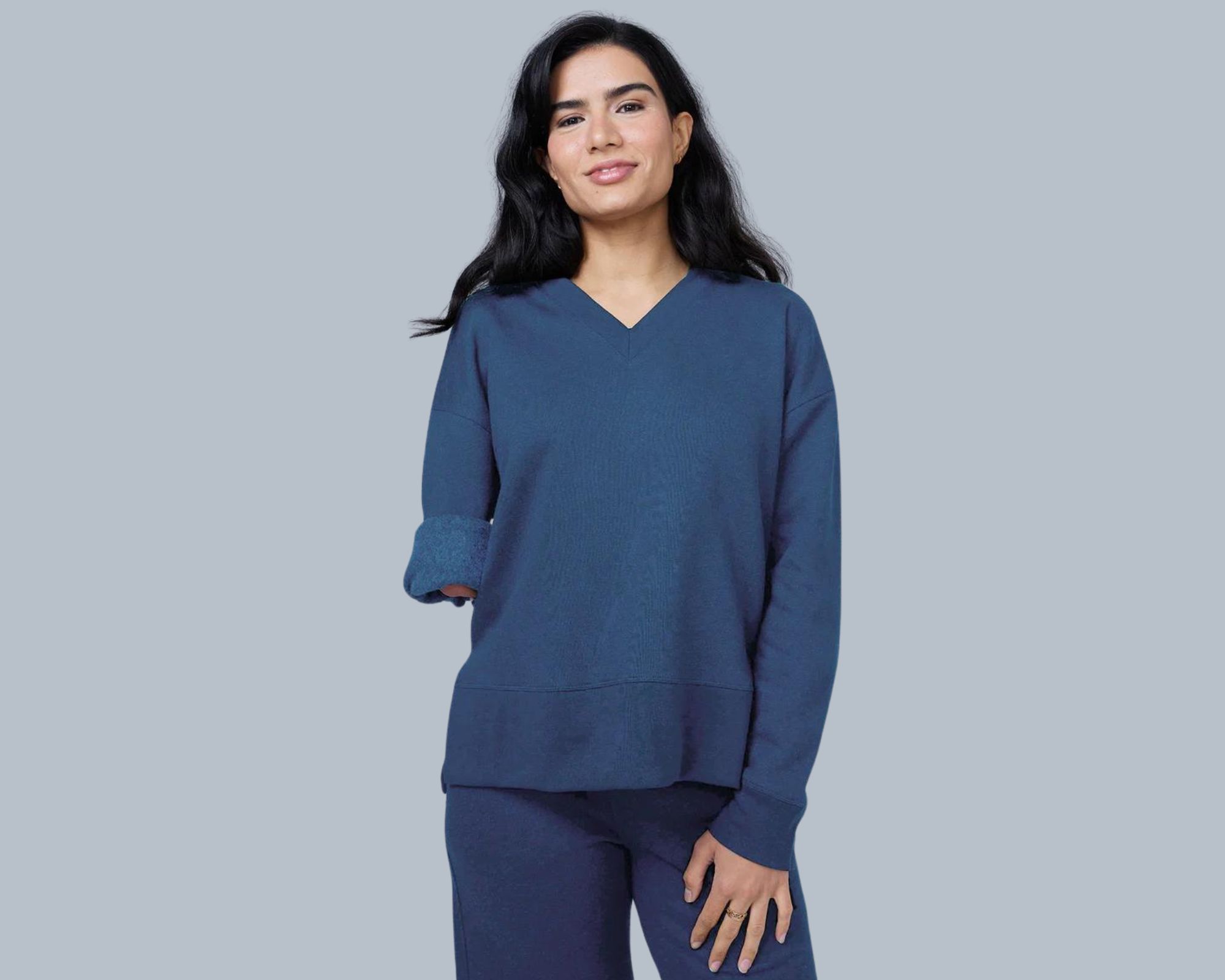 A blue v-neck sweatshirt by hernest project.