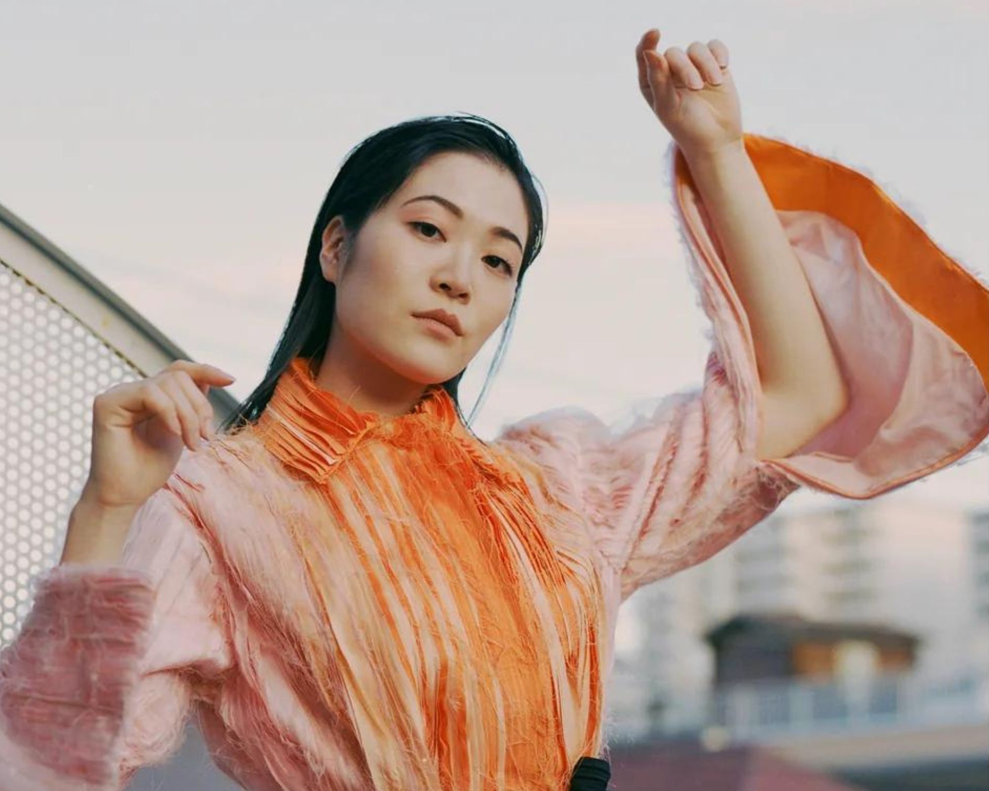 An upcycled orange kimono top by amaud.